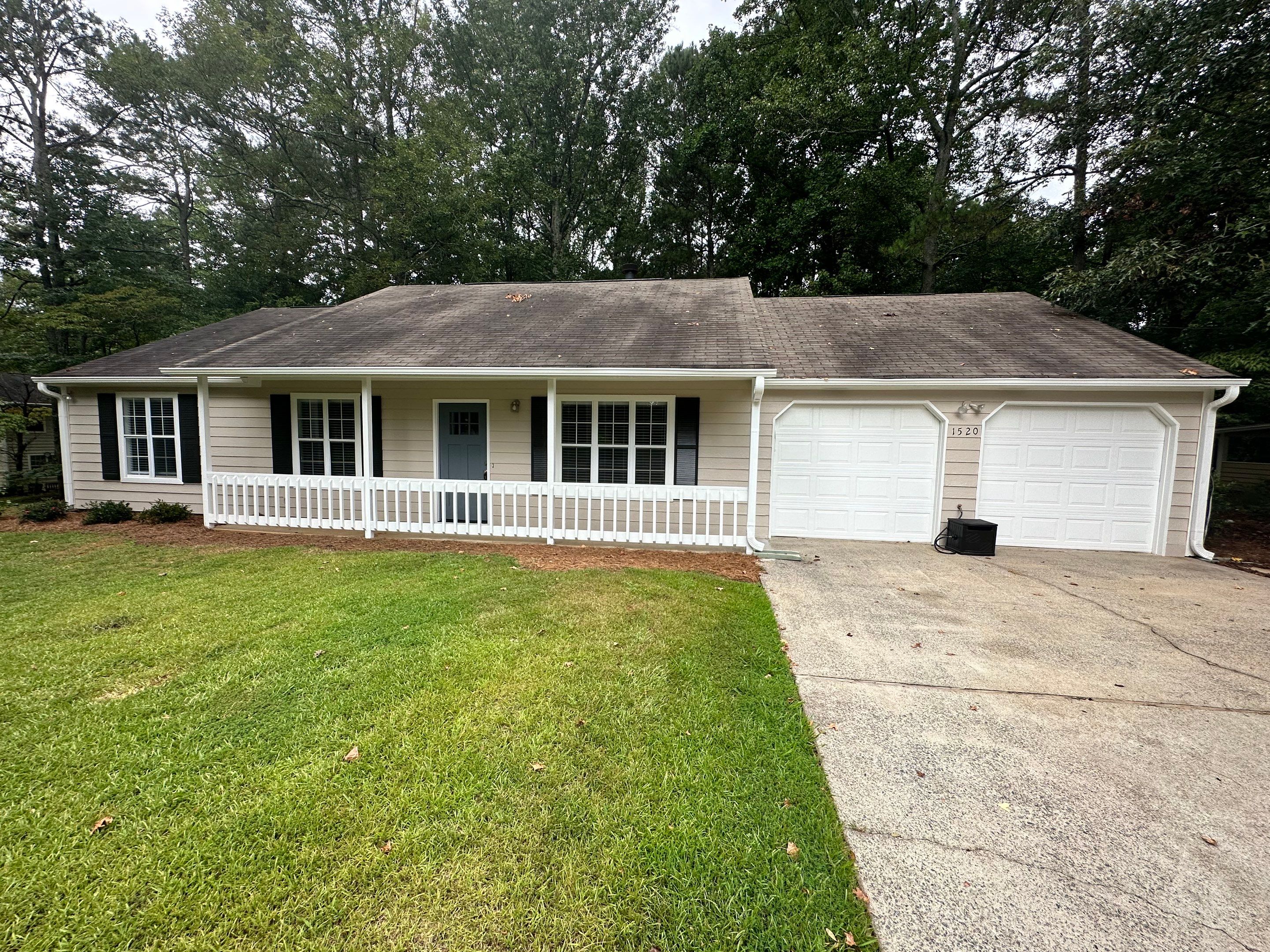 Exterior Siding Painting and Picket Fence Installation in Powder Springs by Swift Home Renovations