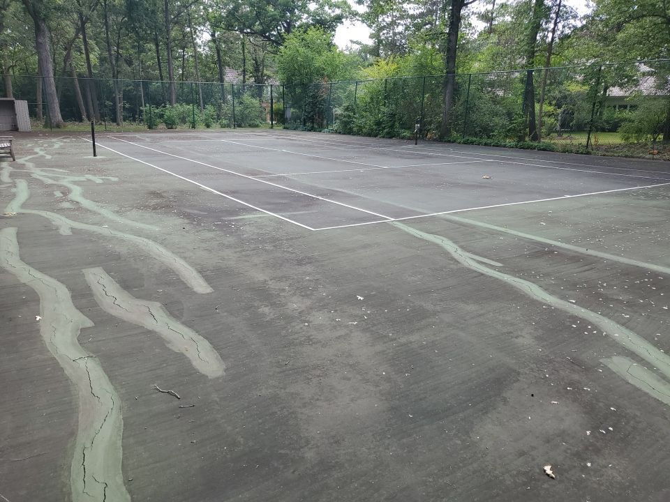 Tennis court cleaning by Northern Power Washing LLC.