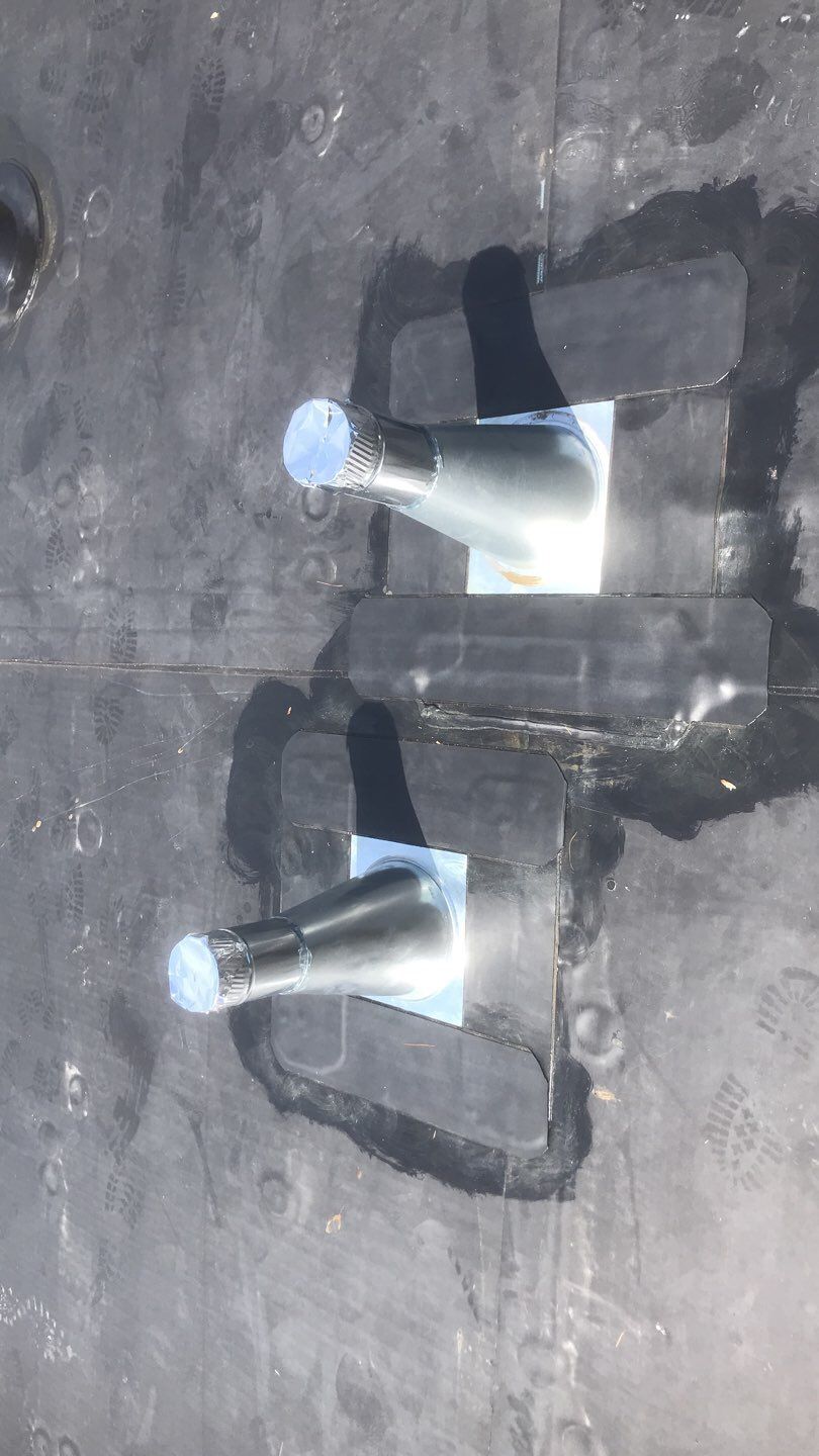 Commercial Roofing Installation using EPDM with white gutters by A Plus Exterior