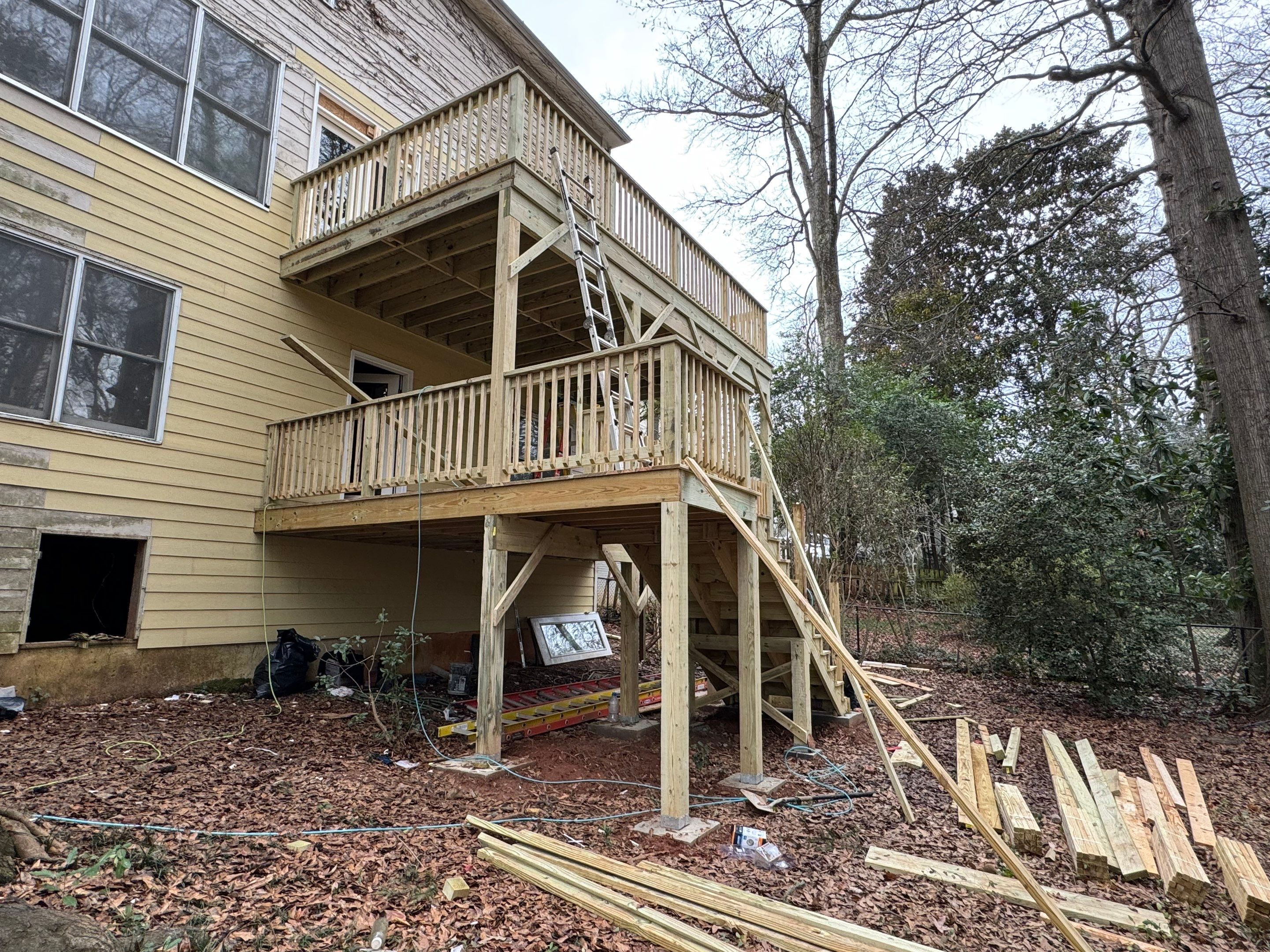 Multi-Level Pressure-Treated Wooden Deck Construction in Decatur by Swift Home Renovations