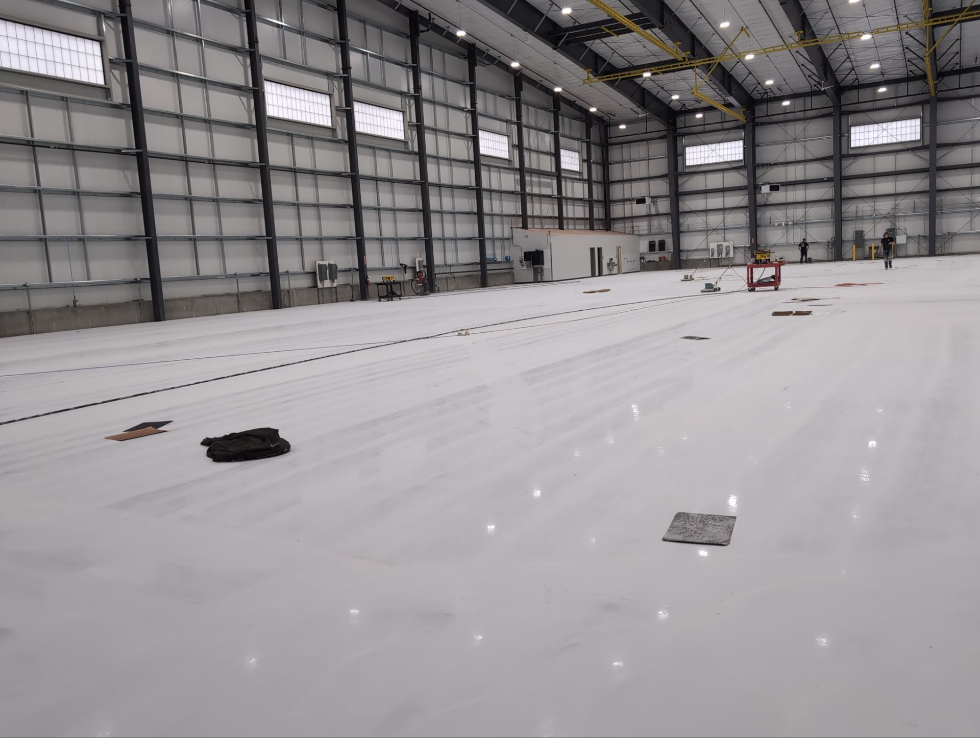 Airplane Hanger using Light Grey Commercial Penntek Epoxy by Croc Coatings, LLC