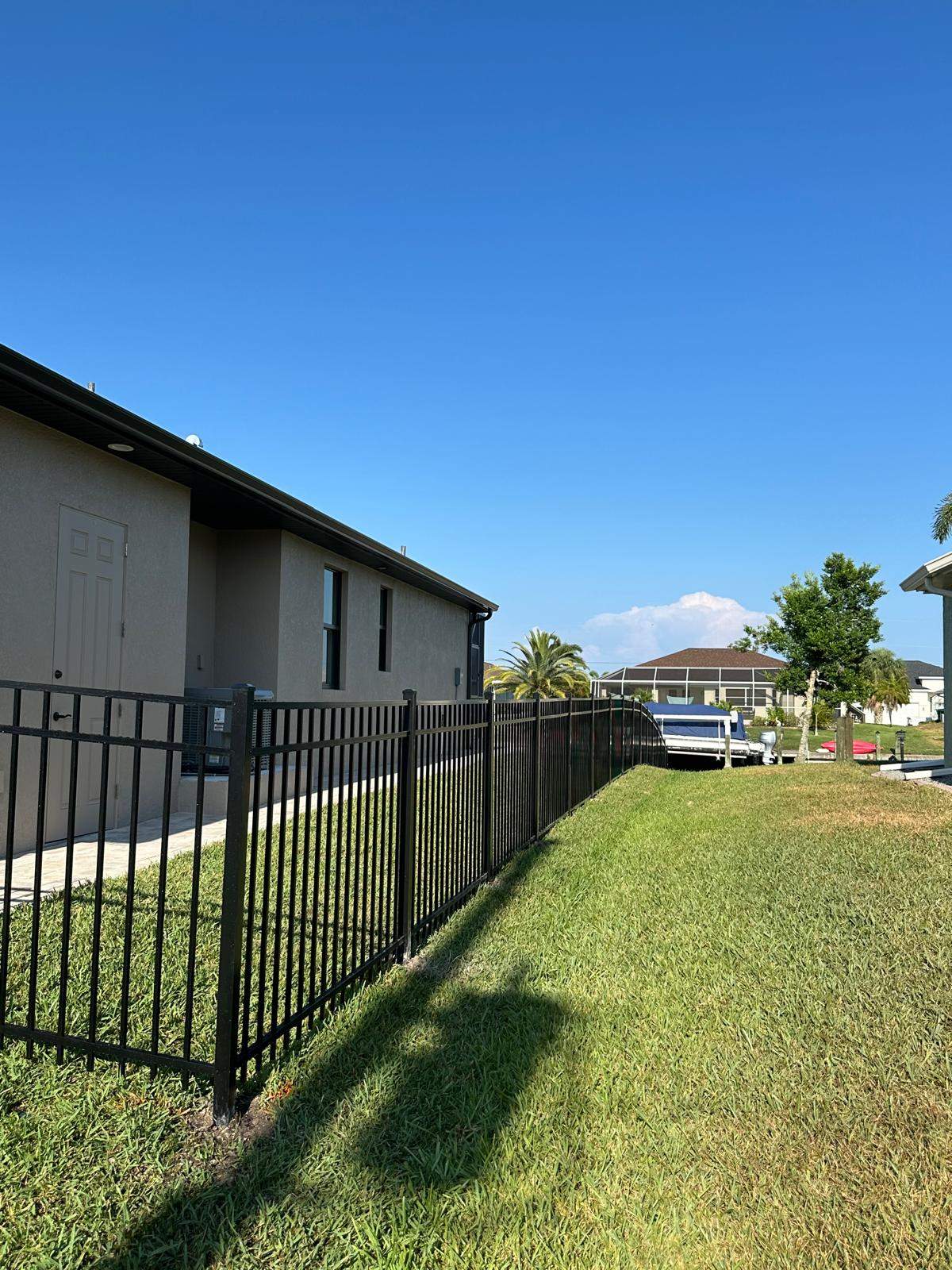 Waterfront Black Aluminum Fence Installation in Port Charlotte by True Fence LLC