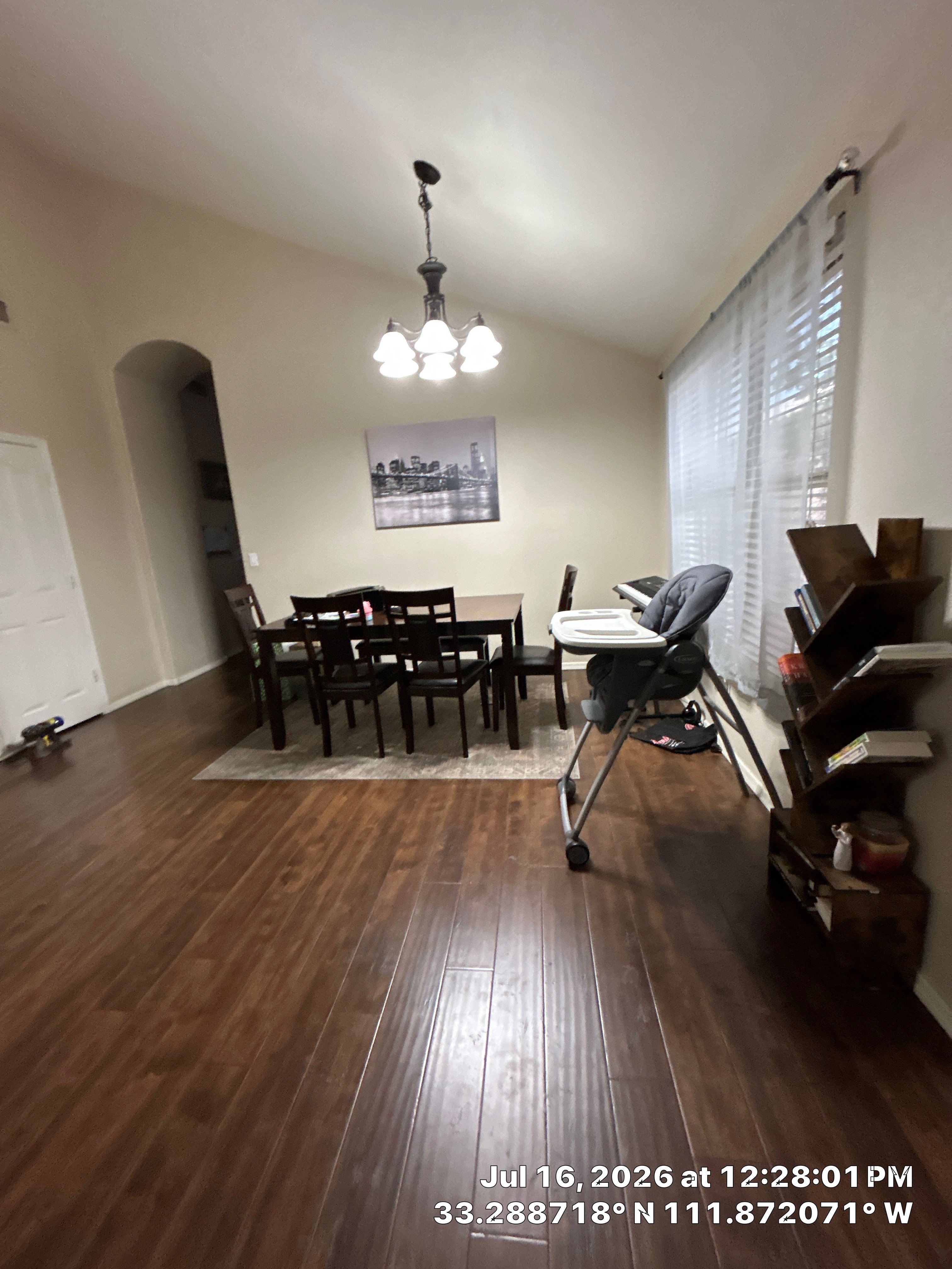 Dark Wood Laminate Flooring Installation for Chandler Dining Room by CompanyCam Sales Demo