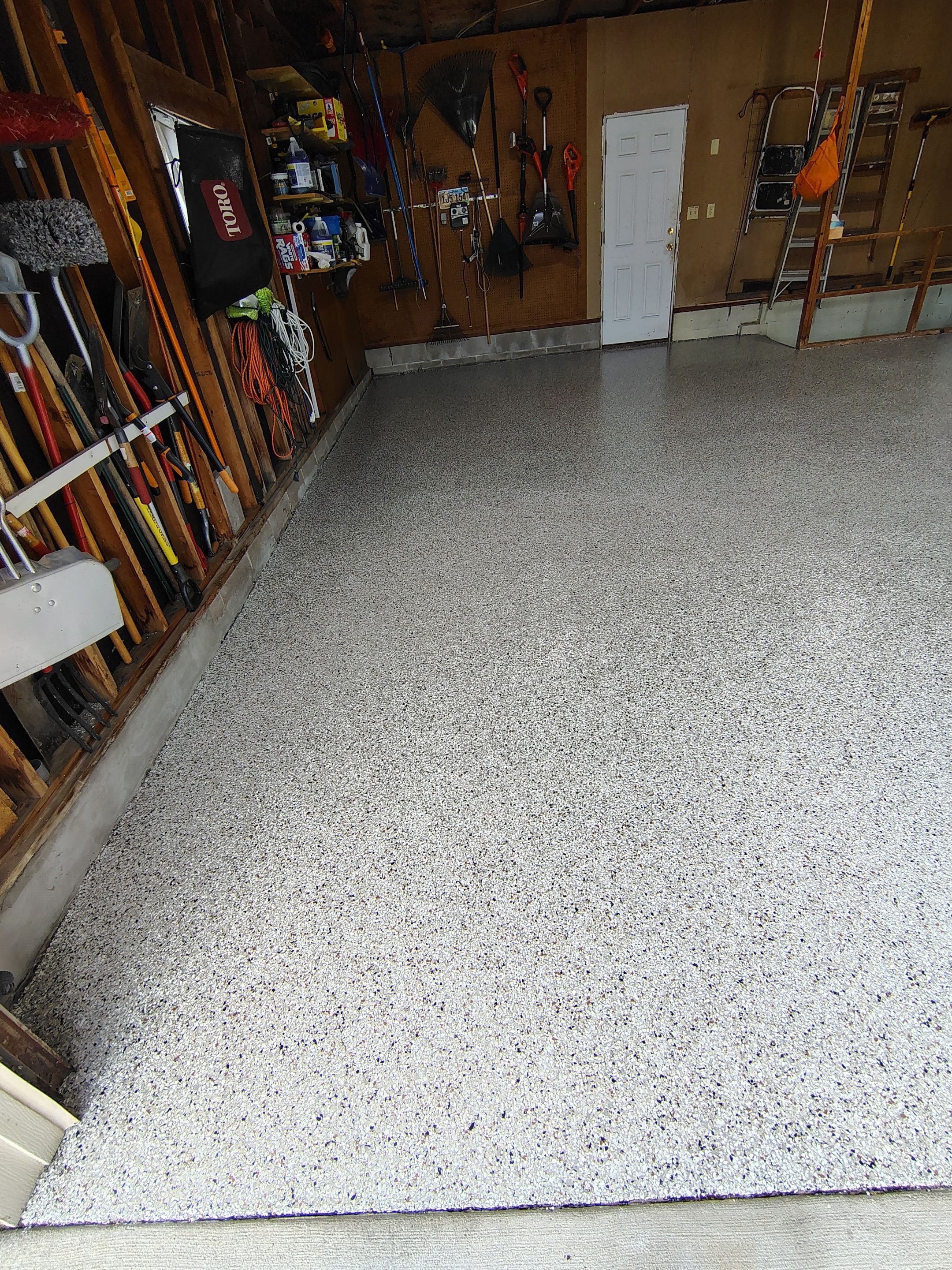 Sioux Falls Garage Epoxy Floor Installation and Concrete Crack Repair by Select Painting, Coatings & Garage Cabinets
