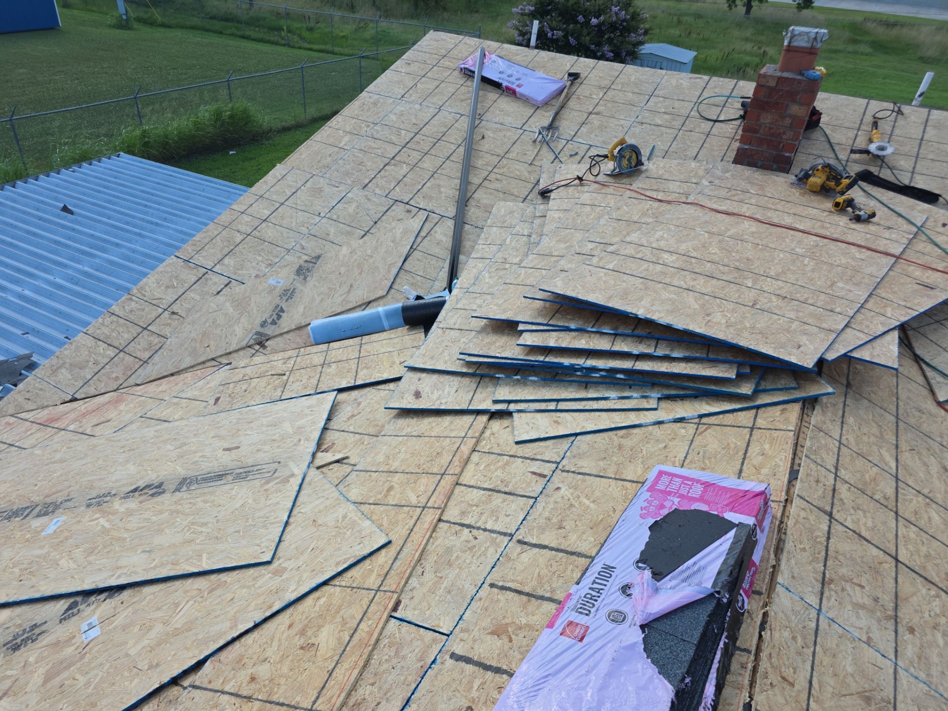 New roof & siding paid by insurance. Along with new roof sheathing.  by In & Out Construction & Remodeling, LLC