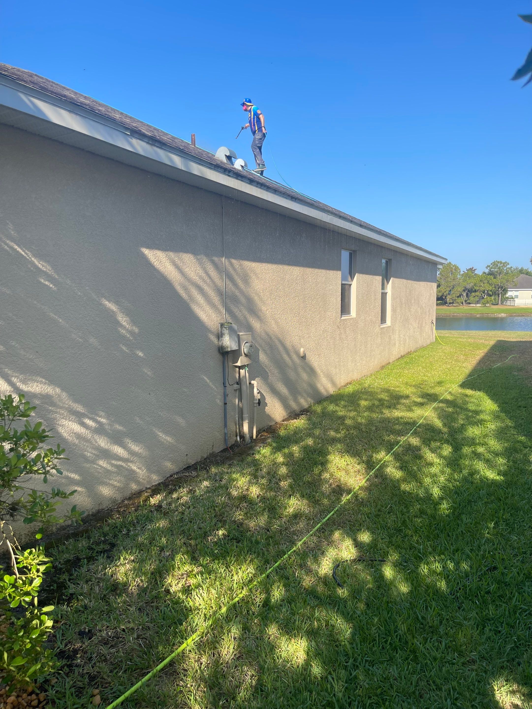 Asphalt Shingle Roof Soft Wash Cleaning & Concrete Pressure Washing in CopperStone Community, Parrish, FL by Sunshine AquaWash