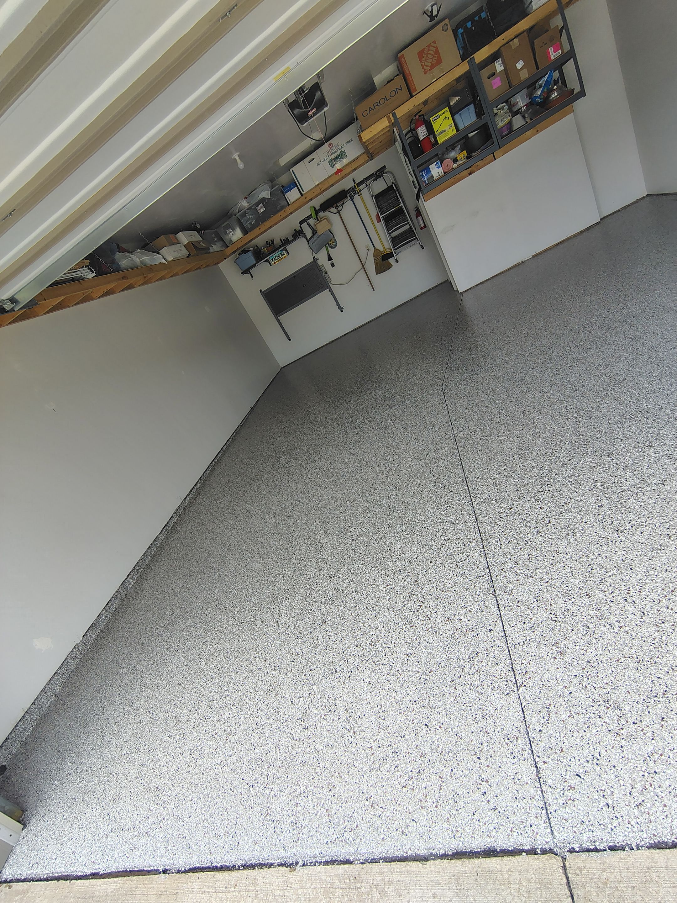 Decorative Chip Garage Concrete Coating Installation in Sioux Falls by Select Painting, Coatings & Garage Cabinets