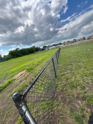 Black Vinyl-Coated Chain Link Fence and Residential Site Grading