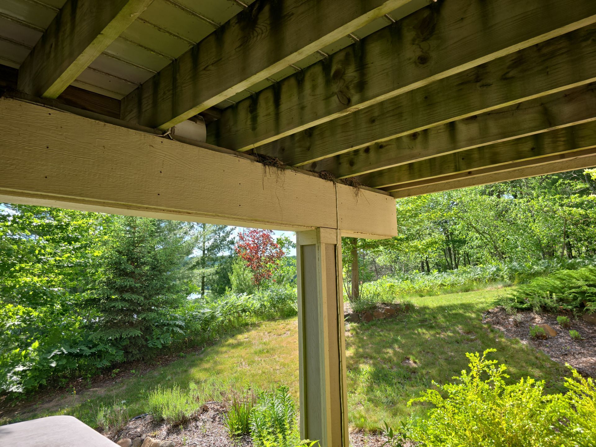 Traverse City Underdecking Installation with Integrated Seamless Gutter System by Rainbow Seamless Systems