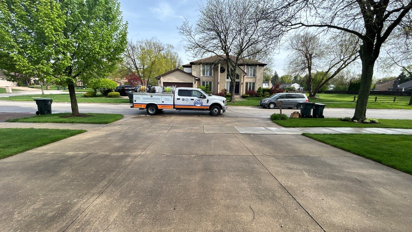 concrete patio and driveway cleaning by Northern Power Washing LLC.