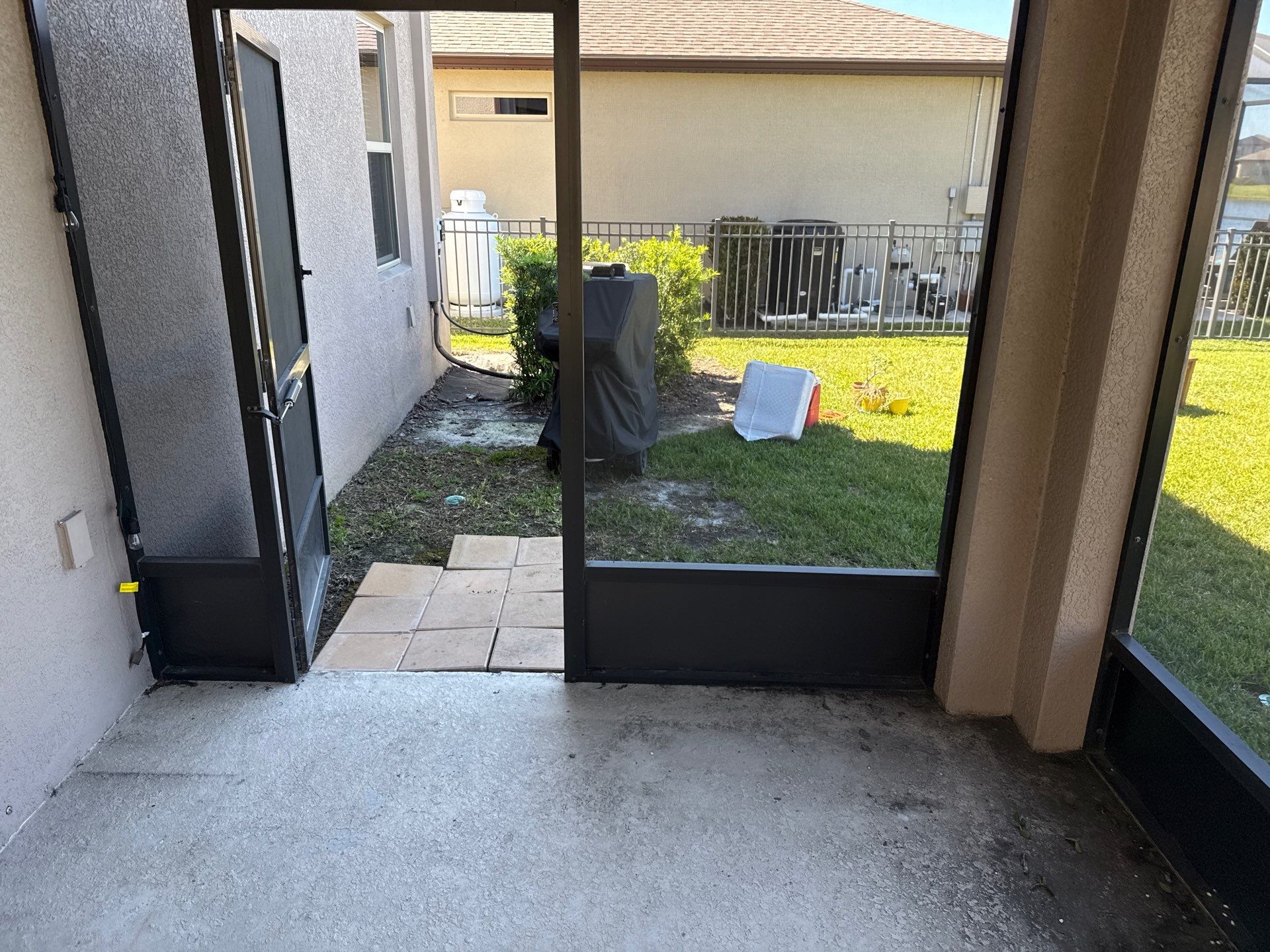 Painted Lanai Floor, Screen Enclosure, and Driveway Cleaning in Trevesta Community, Palmetto, FL by Sunshine AquaWash