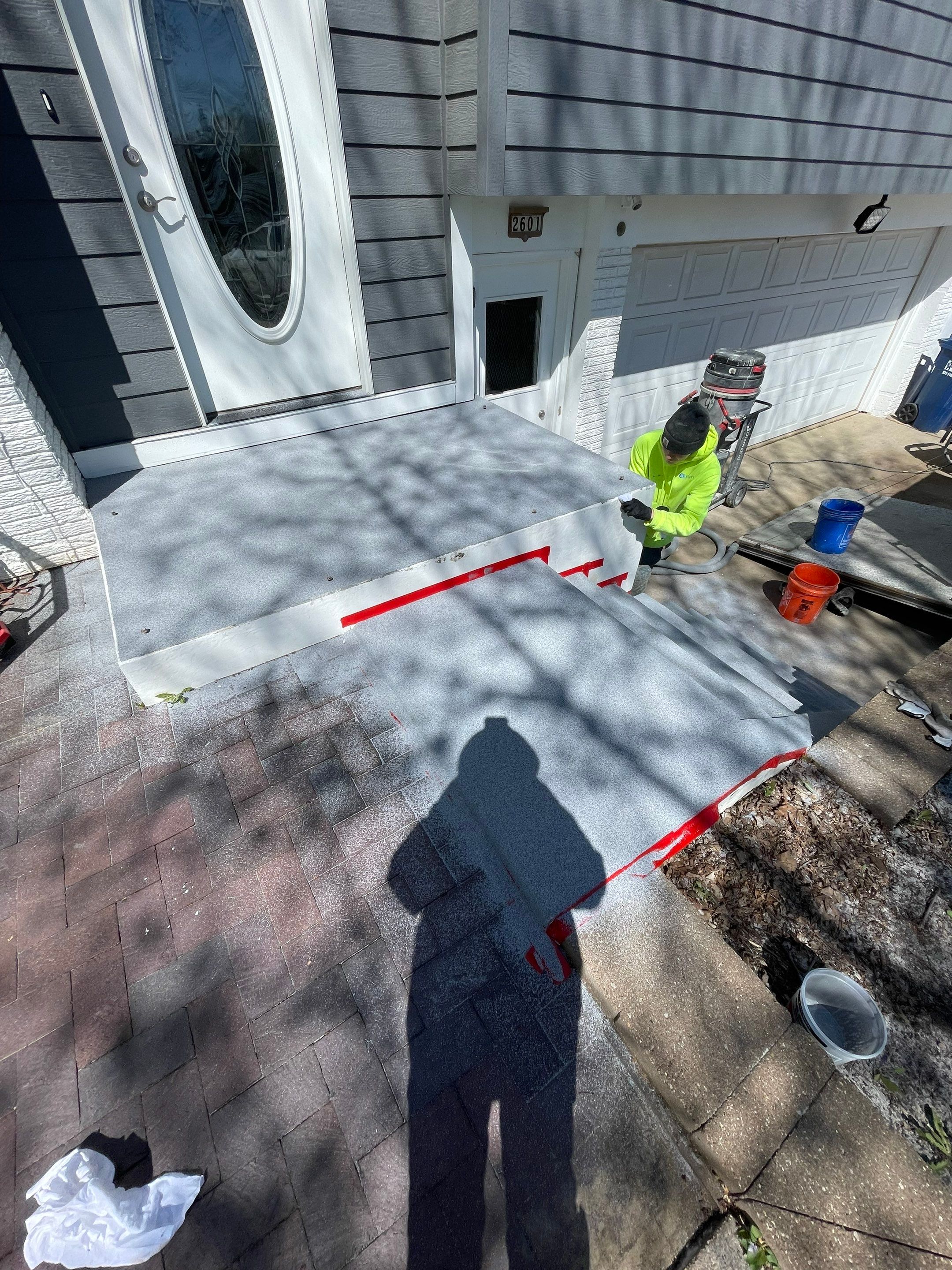 Grey Polyaspartic Porch and Stair Resurfacing in Sioux Falls by Select Painting, Coatings & Garage Cabinets
