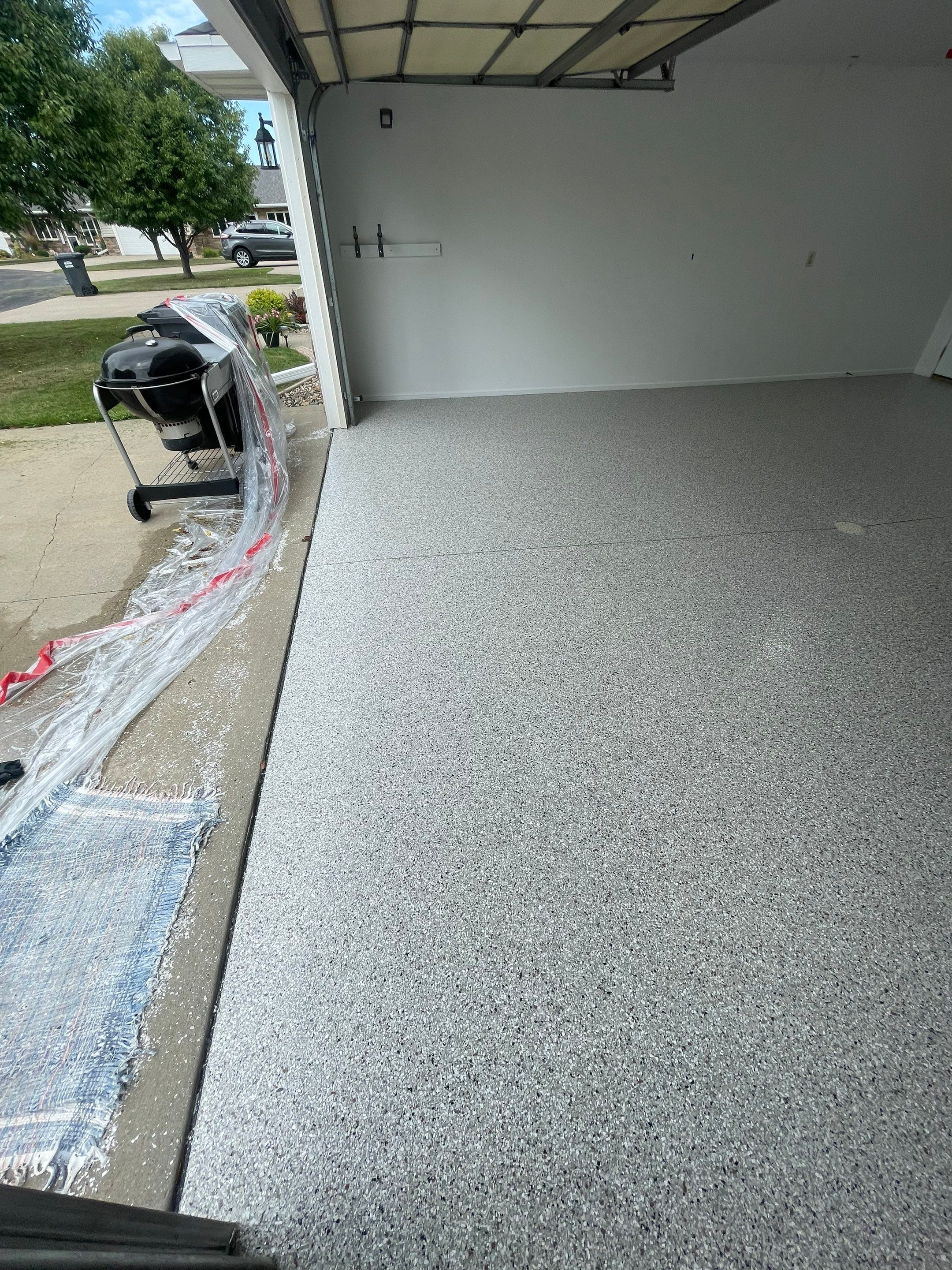 Coyote Flake Garage Floor Coating in Worthington, Minnesota by Select Painting, Coatings & Garage Cabinets