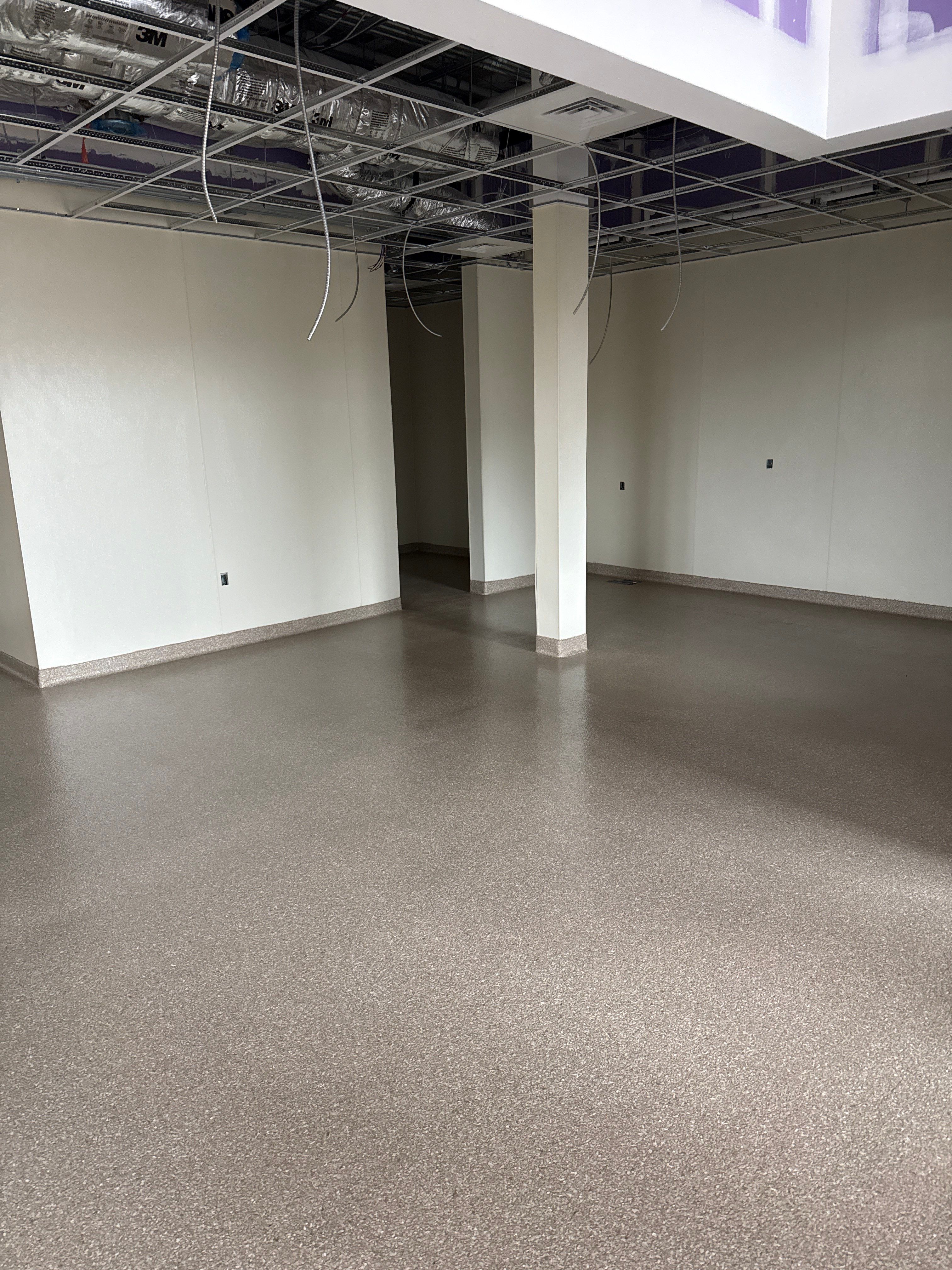 Industrial Epoxy Flake and Concrete Overlay Floor Installation in Pensacola by Cornerstone Hard Surface Restoration
