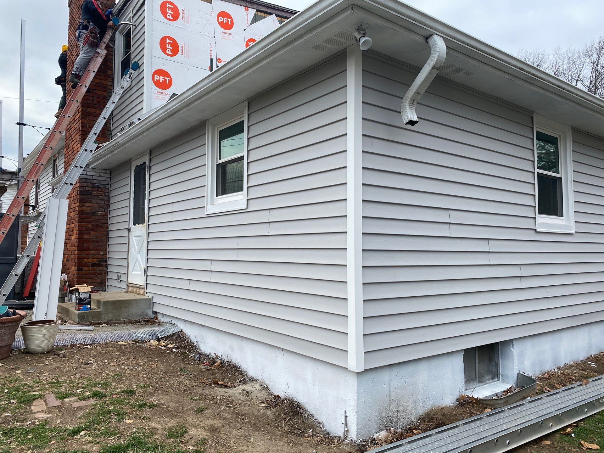 Installed New Vinyl Siding by EEC Windows, Siding & Roofing