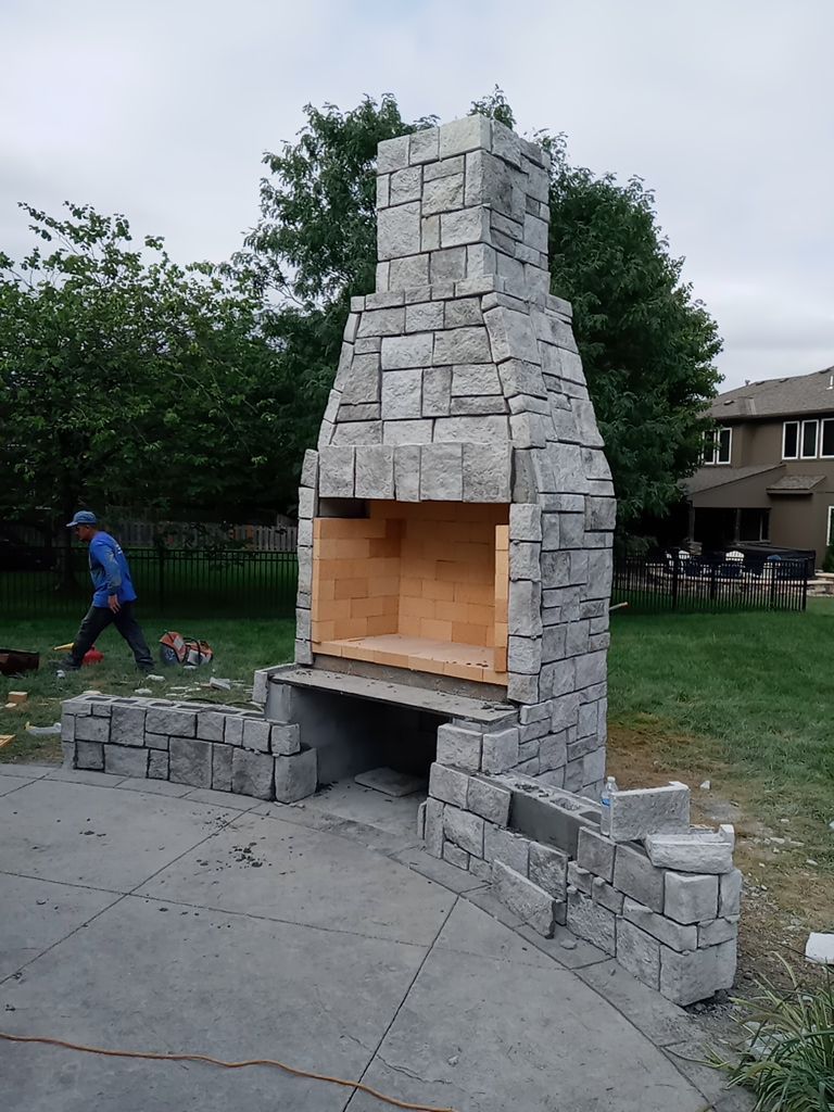 Back Yard Fireplace and Landscape by LAND ESCAPES LLC