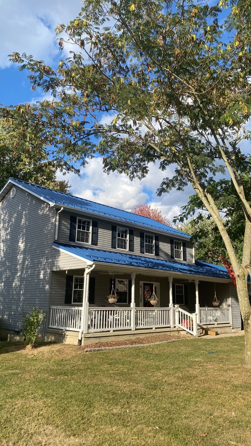 Residential Roofing Installation using Standing Seam Metal - Gallary Blue by RoofX 