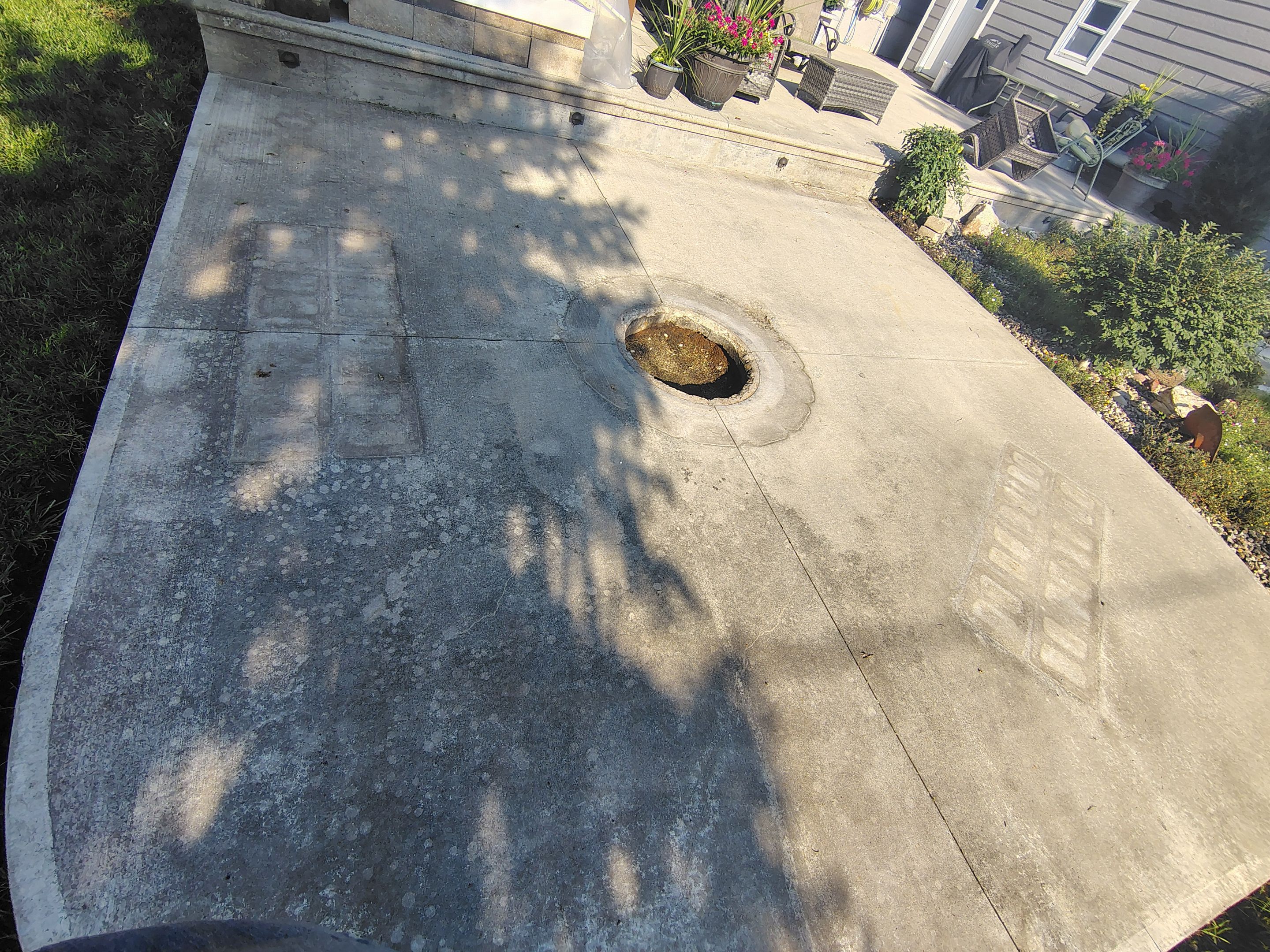 Custom Garage Floor Coating and Backyard Patio Refinishing in Tyndall by Select Painting, Coatings & Garage Cabinets