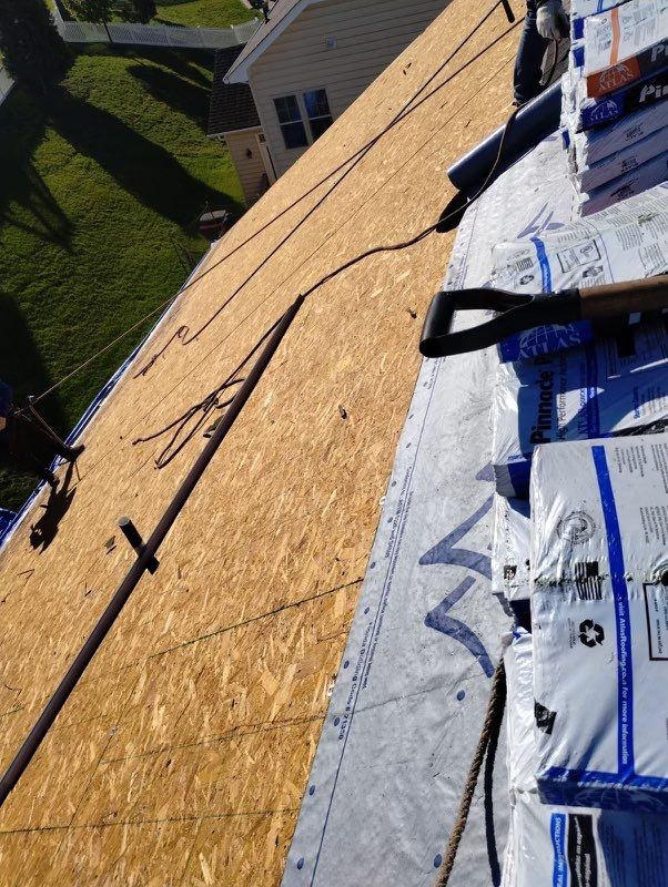 Residential Roofing Installation using Atlas Pinnacle Pristine Black Architectural Shingles by Frederick Roof Repair