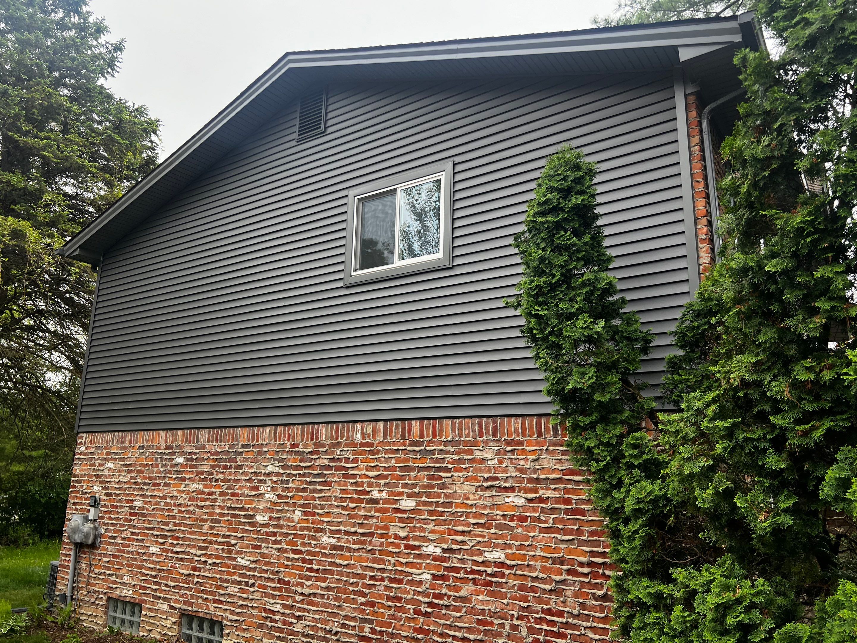 Siding Replacement  using Certainteed Monogram Vinyl D4" Smoky Gray color by Bloomfield Construction & Restoration