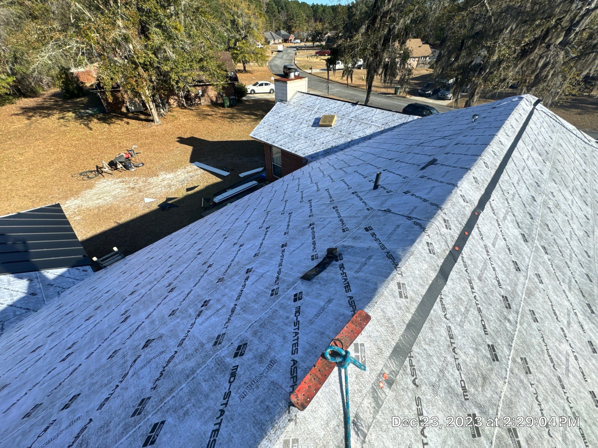 Residential Roofing Installation using Benton 26Ga 1inc Snapcock Metal Roof KYNAR Matte Black by Talya Roofing