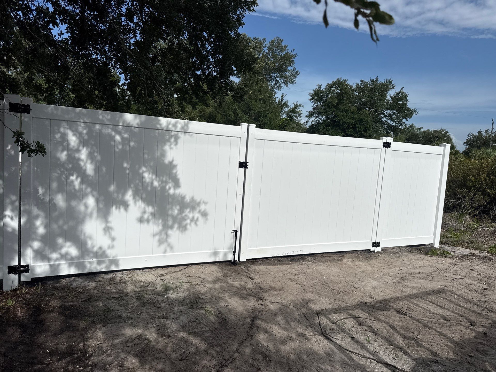 White Vinyl Privacy Fence Installation and Gate Assembly in Punta Gorda by True Fence LLC