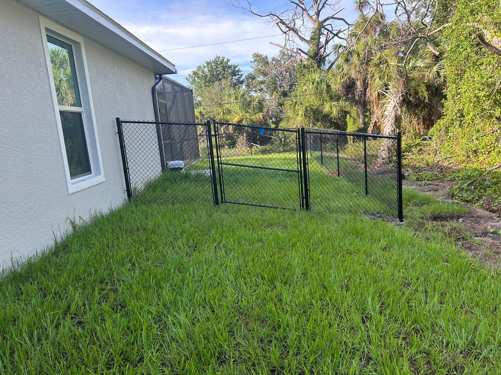 Residential Black Vinyl-Coated Chain Link Fence in Port Charlotte by True Fence LLC