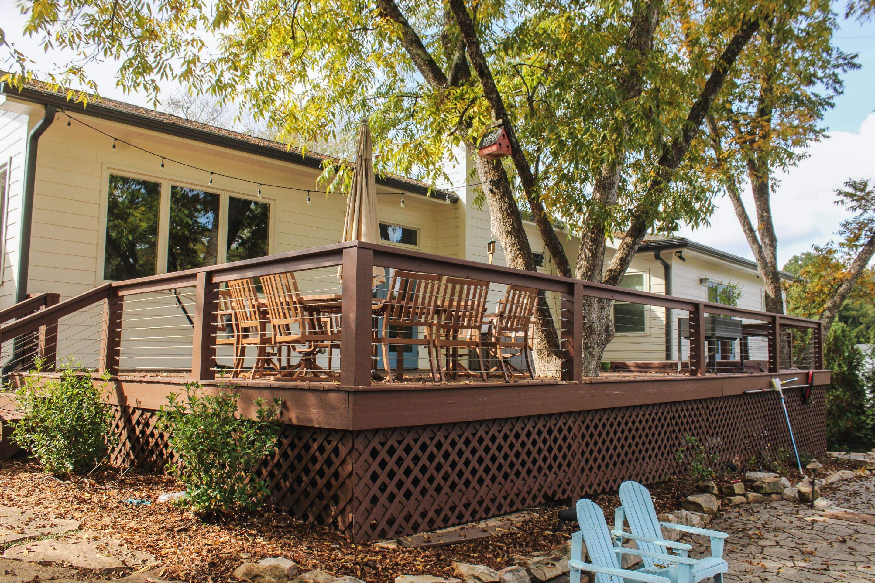 Deck Resurface with Glass Paneling and Deckorators Voyage Series Products by Nelson Exteriors 