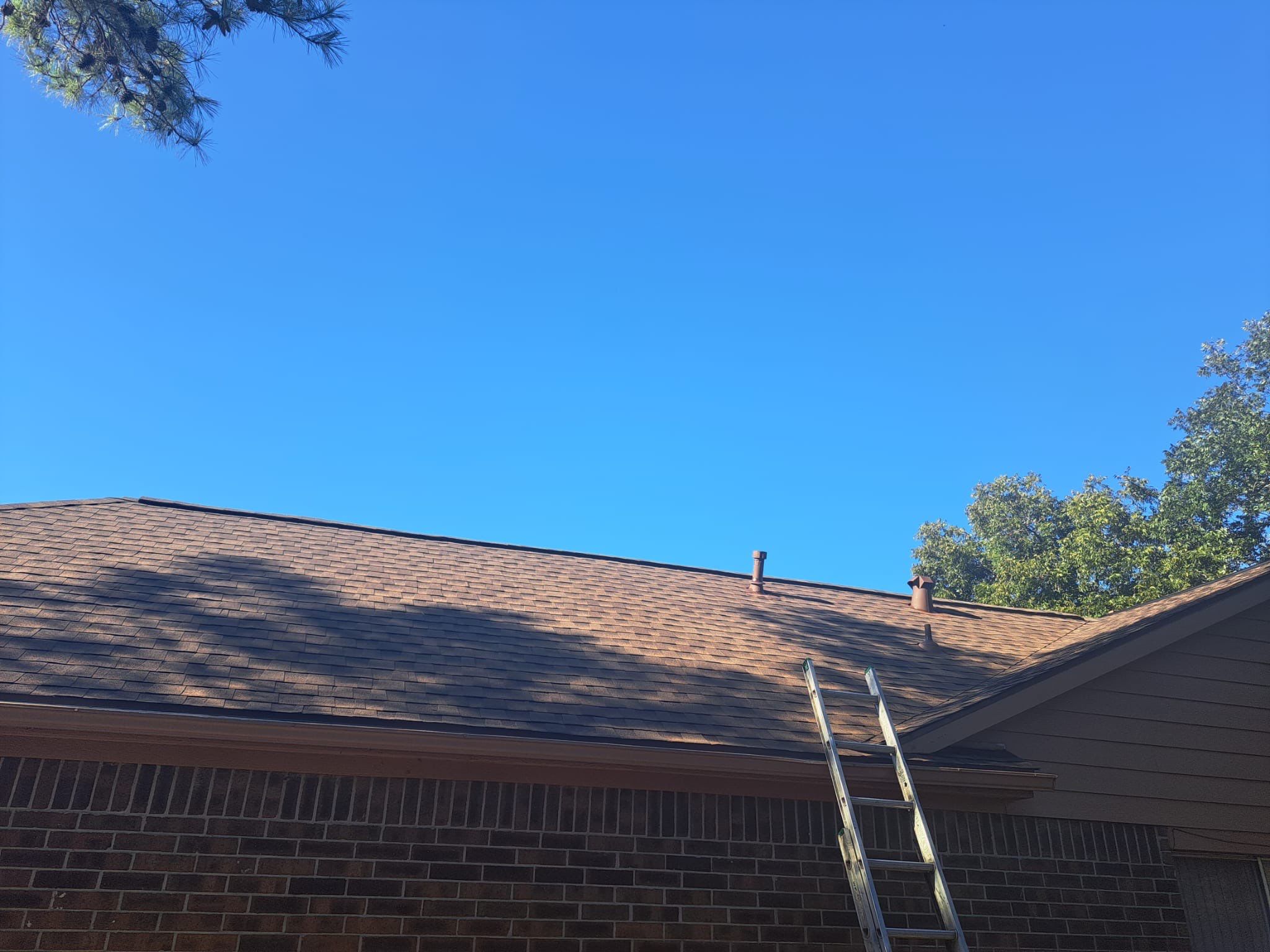 Hail-Marked Roof Replaced in Warm Brown — Houston, TX by PL Roofing & SB Roofing, LLC.