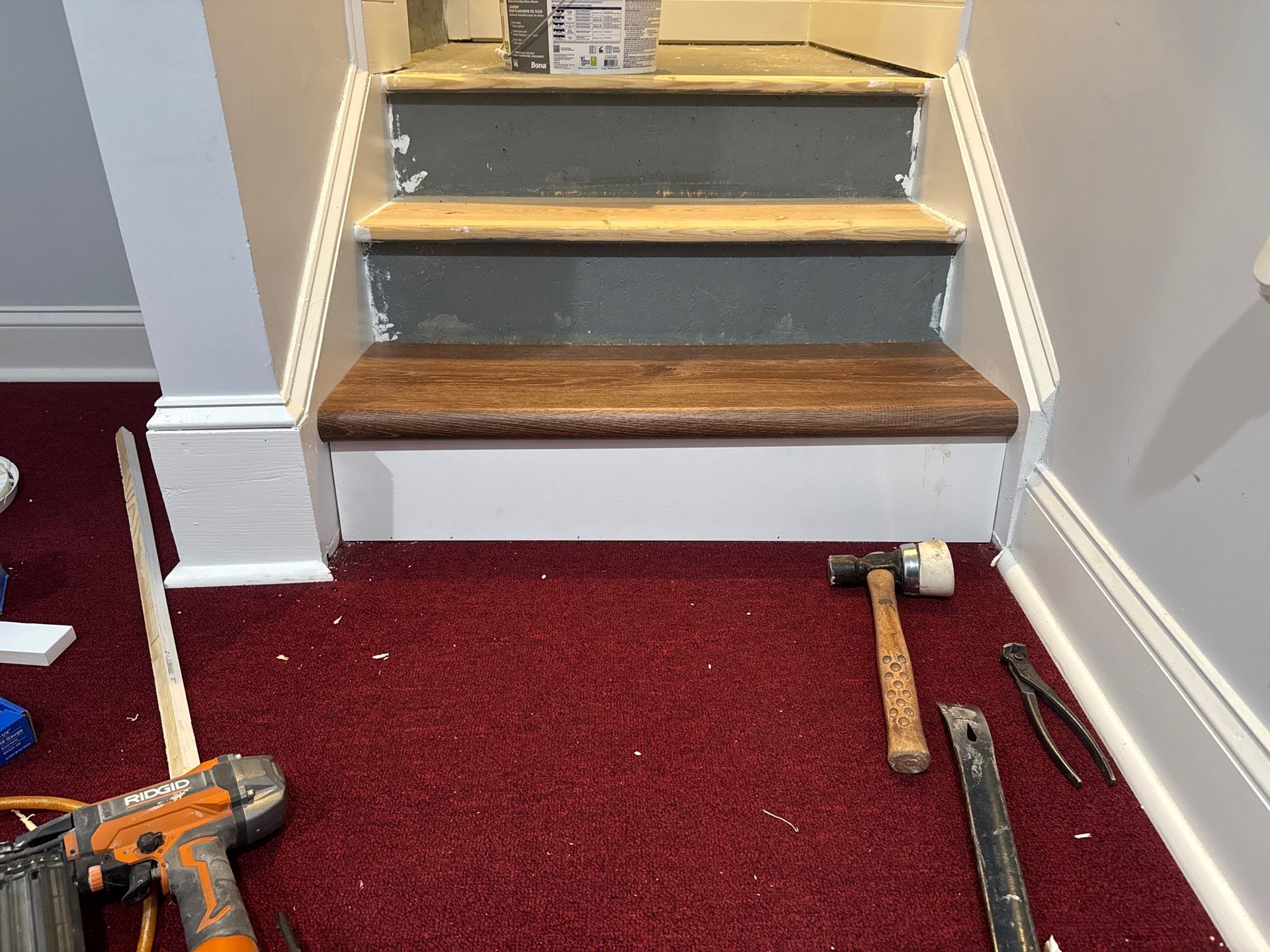 Stairway Installation using t vinyl stair tread and reversibleriser by La Bendicion Contruction Llc