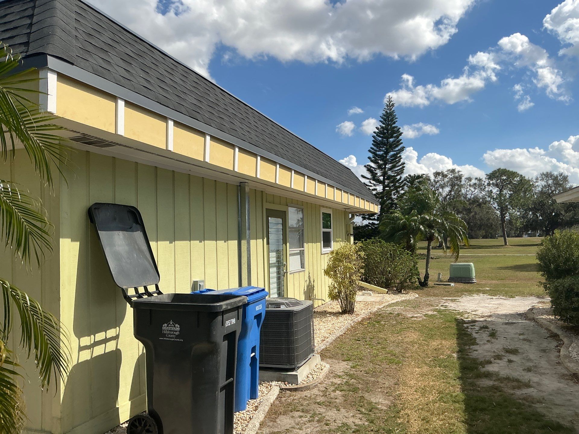 Black 6'' Seamless Gutters K-Style and Black Downspouts in Sun City Center FL by Gutter Professors