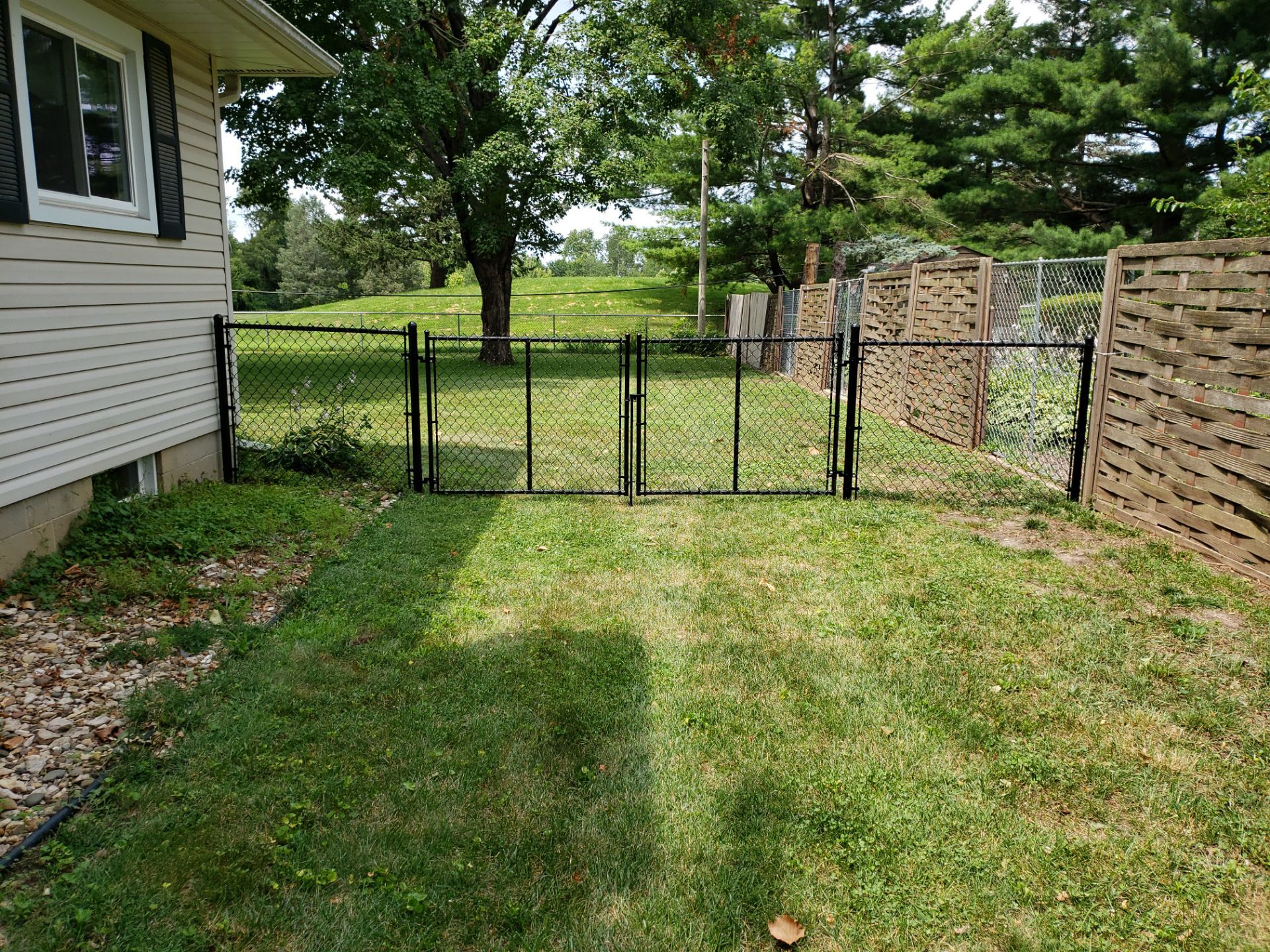 Black Chain Link Fence Installation in Cedar Falls by Perfect Picket Fence and Stain