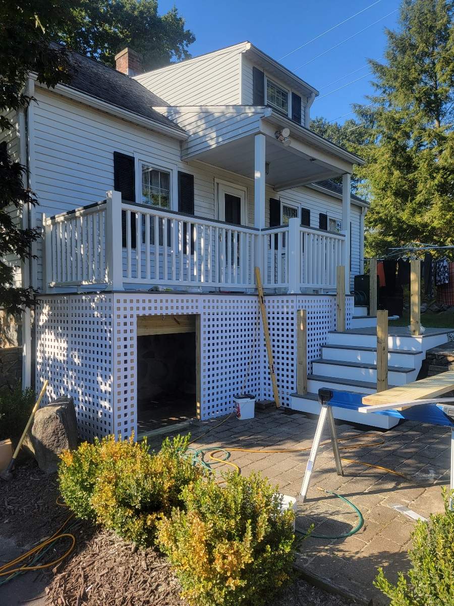 Front deck replacement, Trex tropical Island mist boards and matching cocktail rail, Lattice bottom with access door by DiGiorgi Roofing and Siding Inc