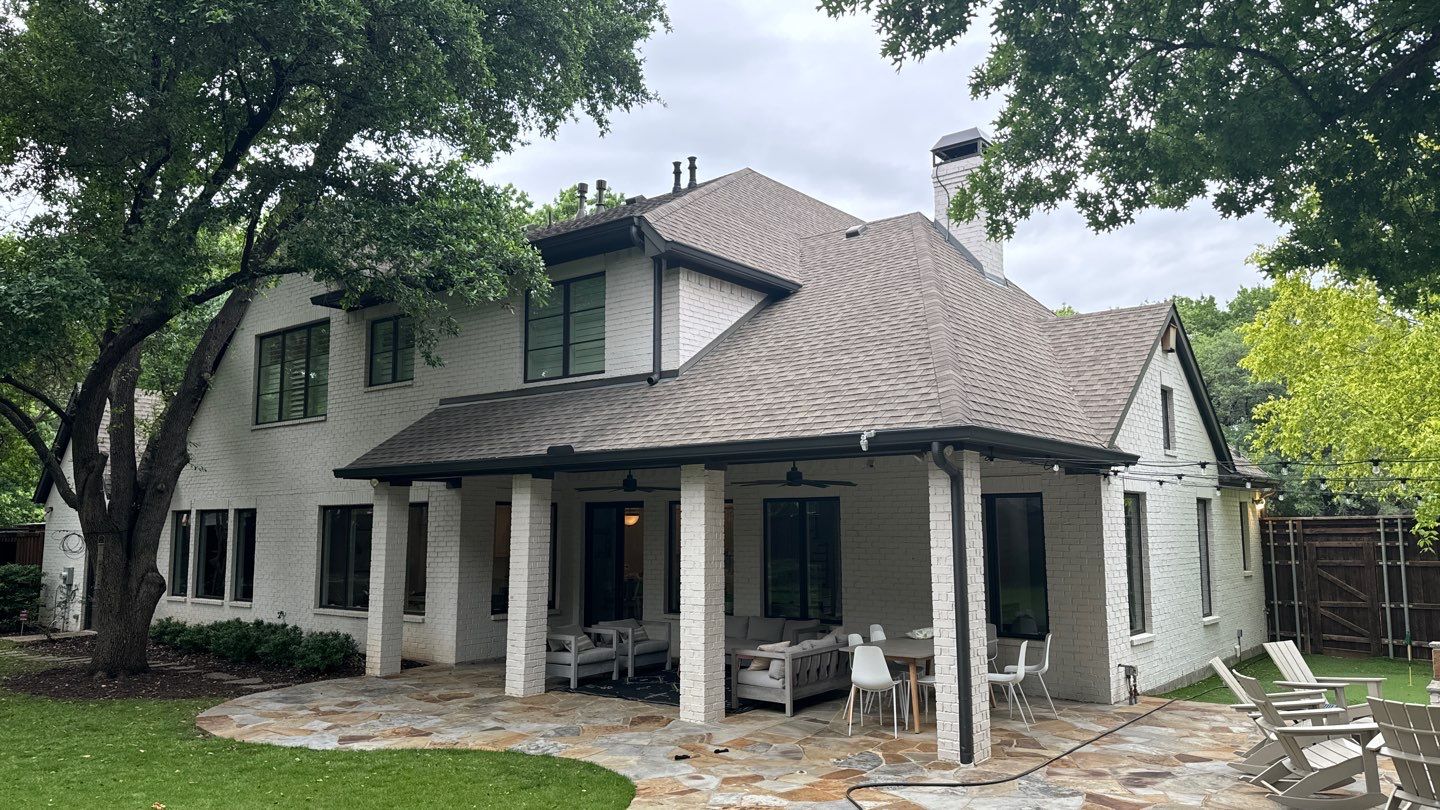 White brick with GAF Weathered Wood by Tejas Roofworks + Restoration