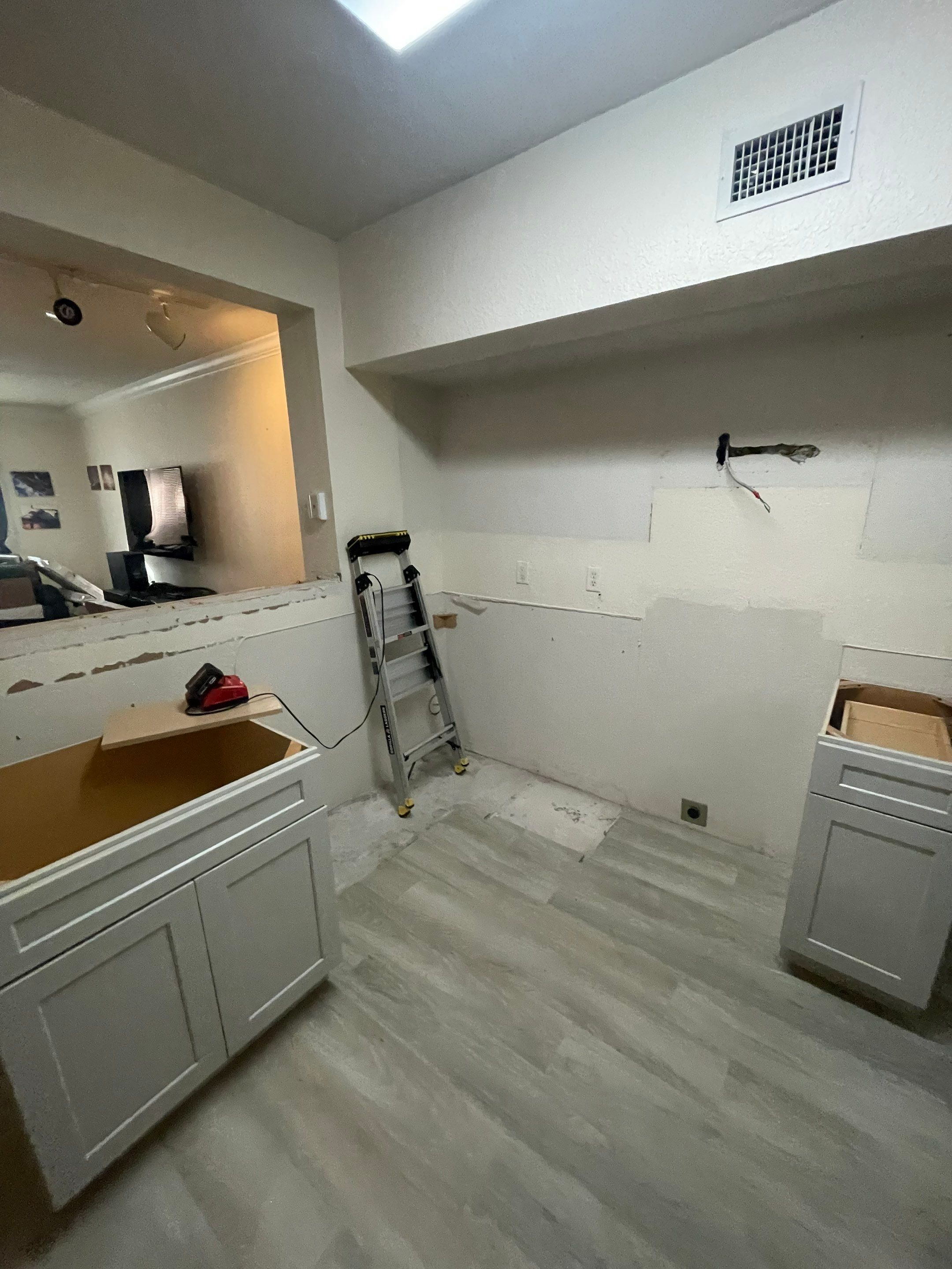 Home Remodel using LVP Flooring and Cabinets by HandyMangum