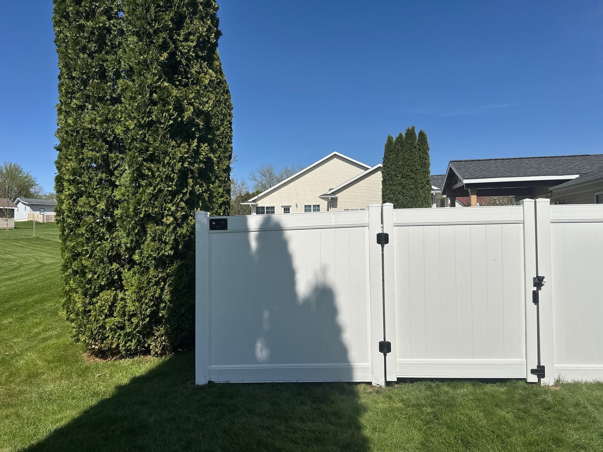 White Vinyl Privacy Fence Installation in Raymond, Iowa by Perfect Picket Fence and Stain