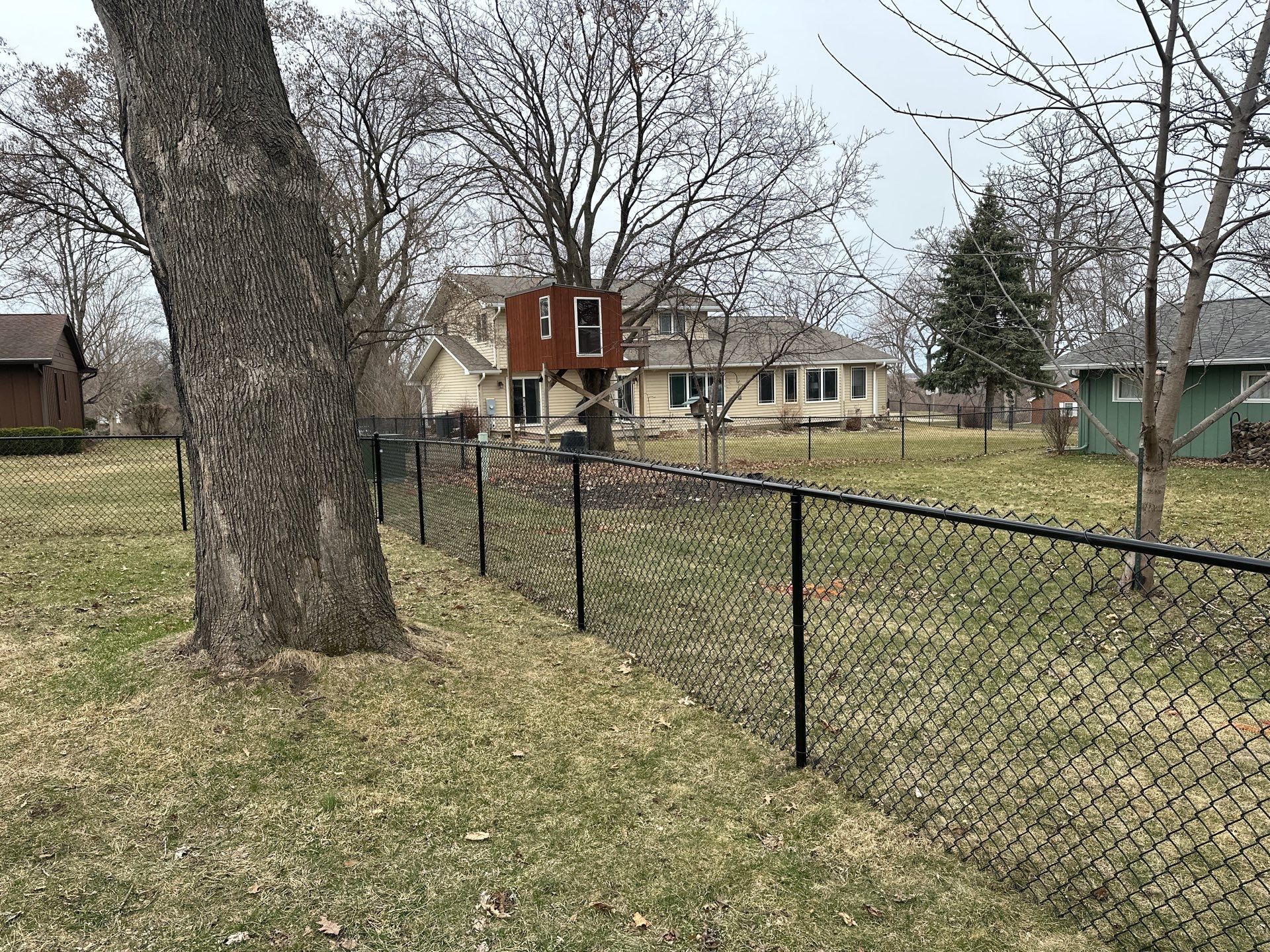 Black Vinyl Chain Link Fence Installation in Cedar Falls by Perfect Picket Fence and Stain