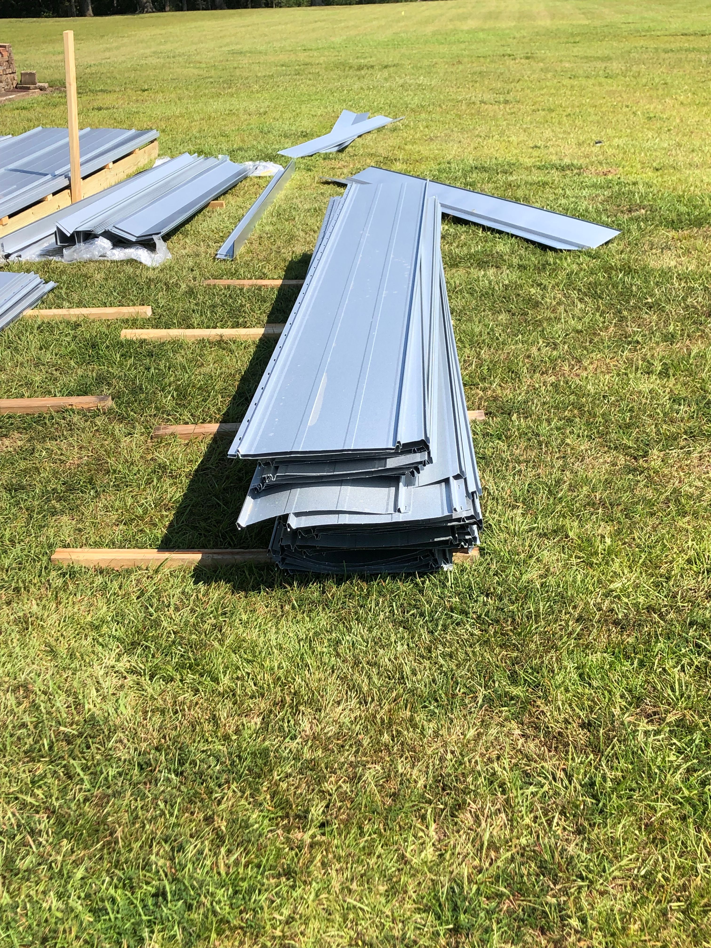 Residential Roofing Installation using Metal roofing by American Roofing & Construction LLC