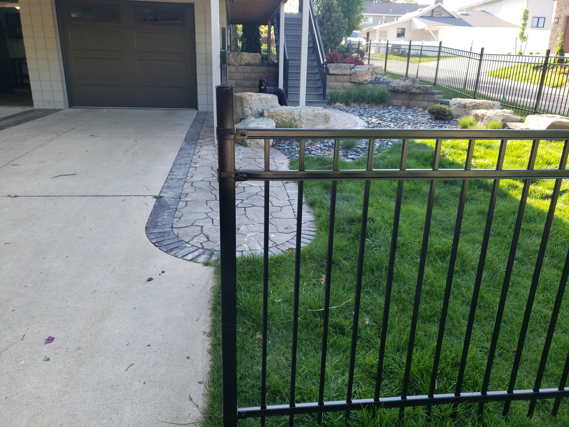 Ornamental Black Metal Picket Fence Installation in Cedar Falls by Perfect Picket Fence and Stain