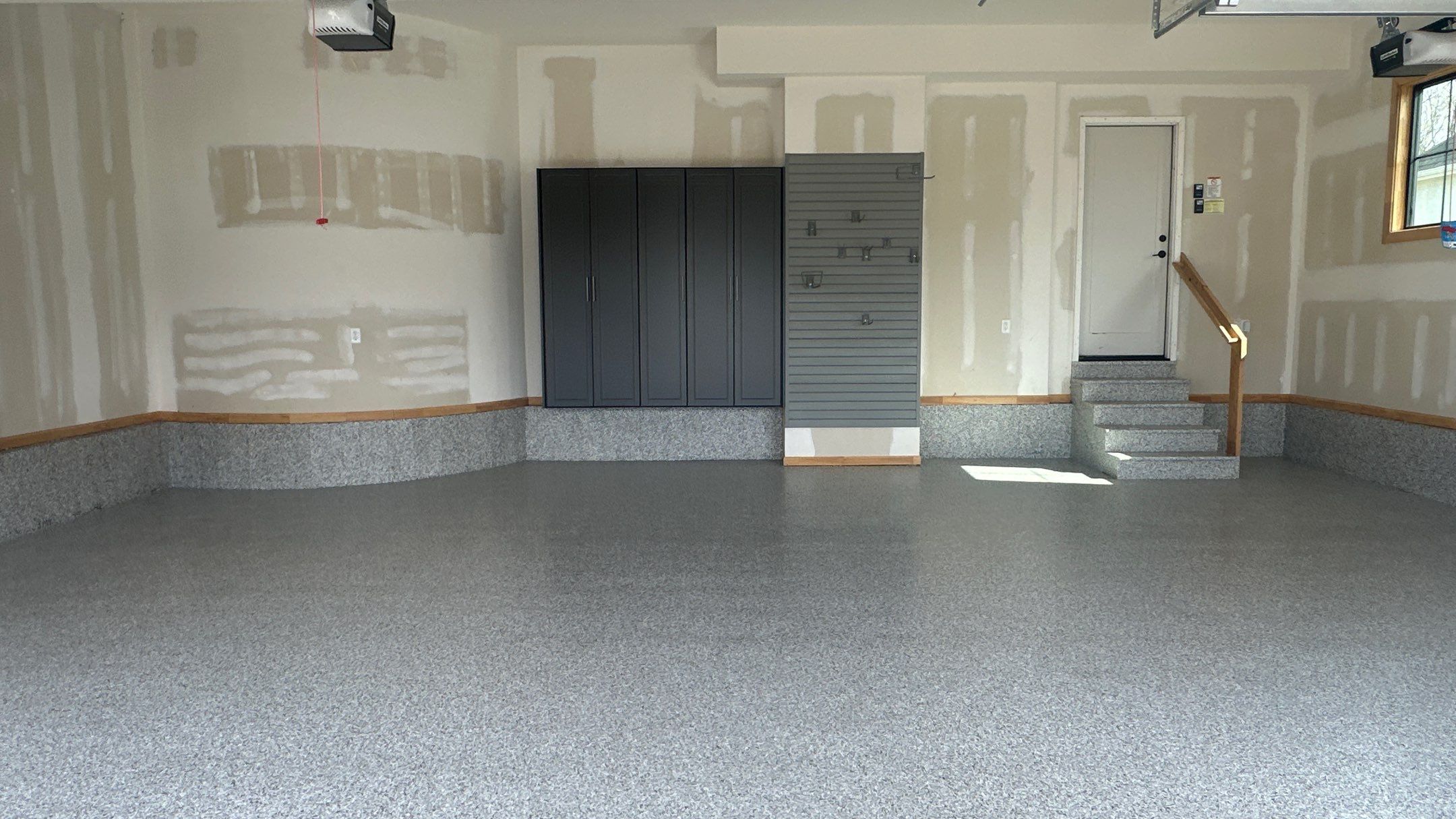 Megan J. added cabinets and slotwall to her garage. Plus a New Floor by Banner Garage