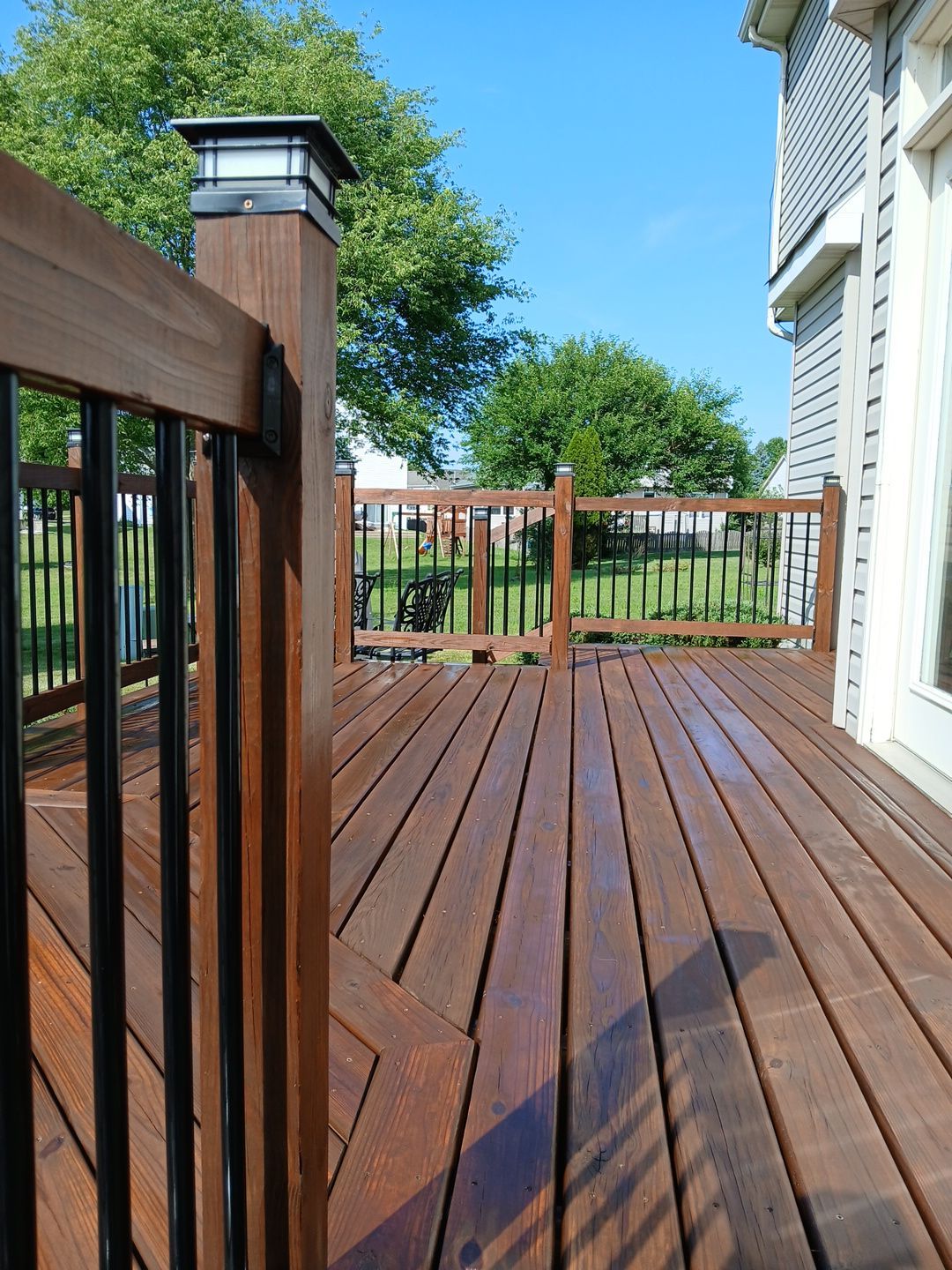 Tucker Deck Staining  by Two Brothers Residential Maintenance