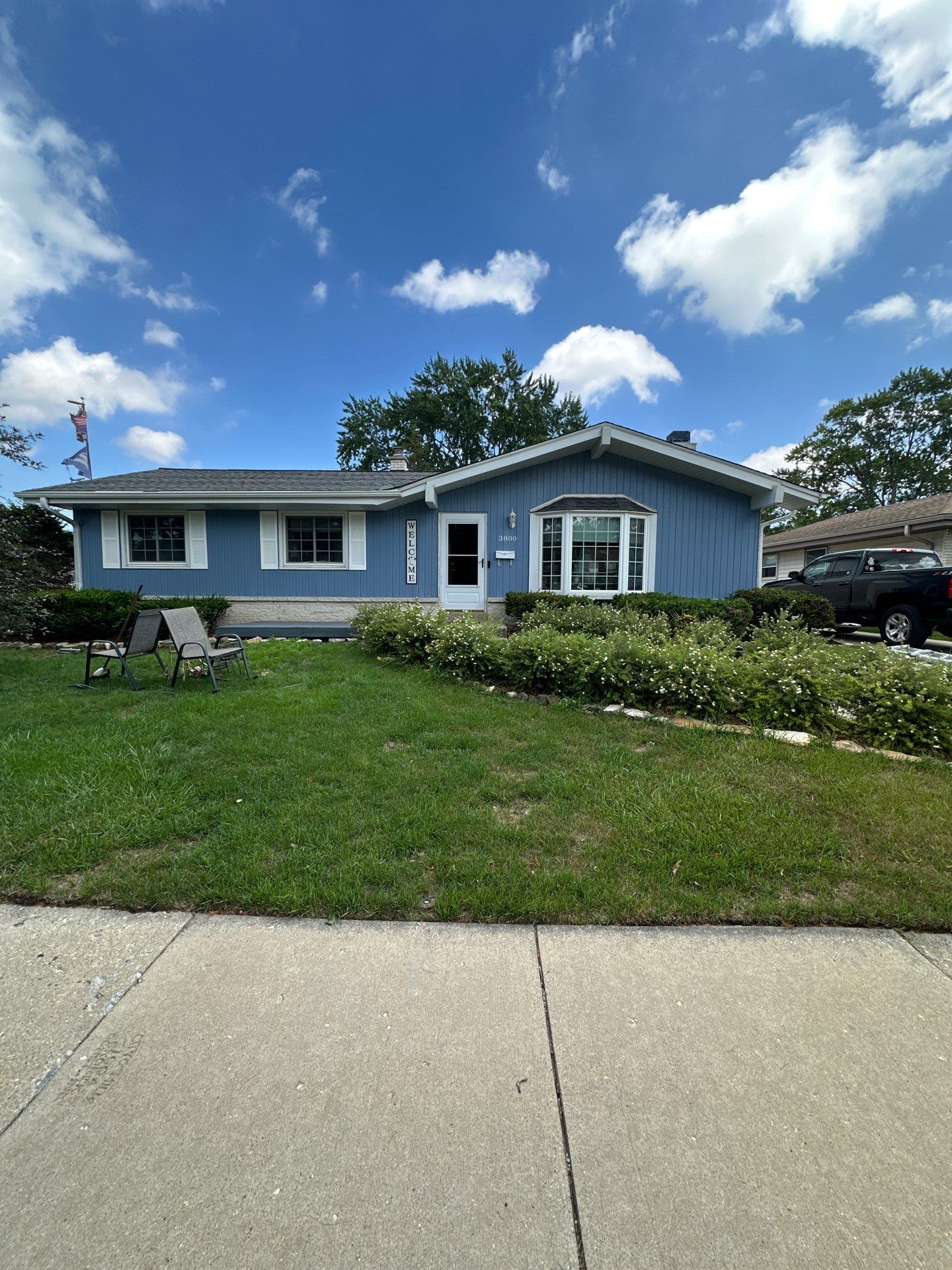 Blue Vertical Siding and Trim Installation in Milwaukee by OCS Contracting Services