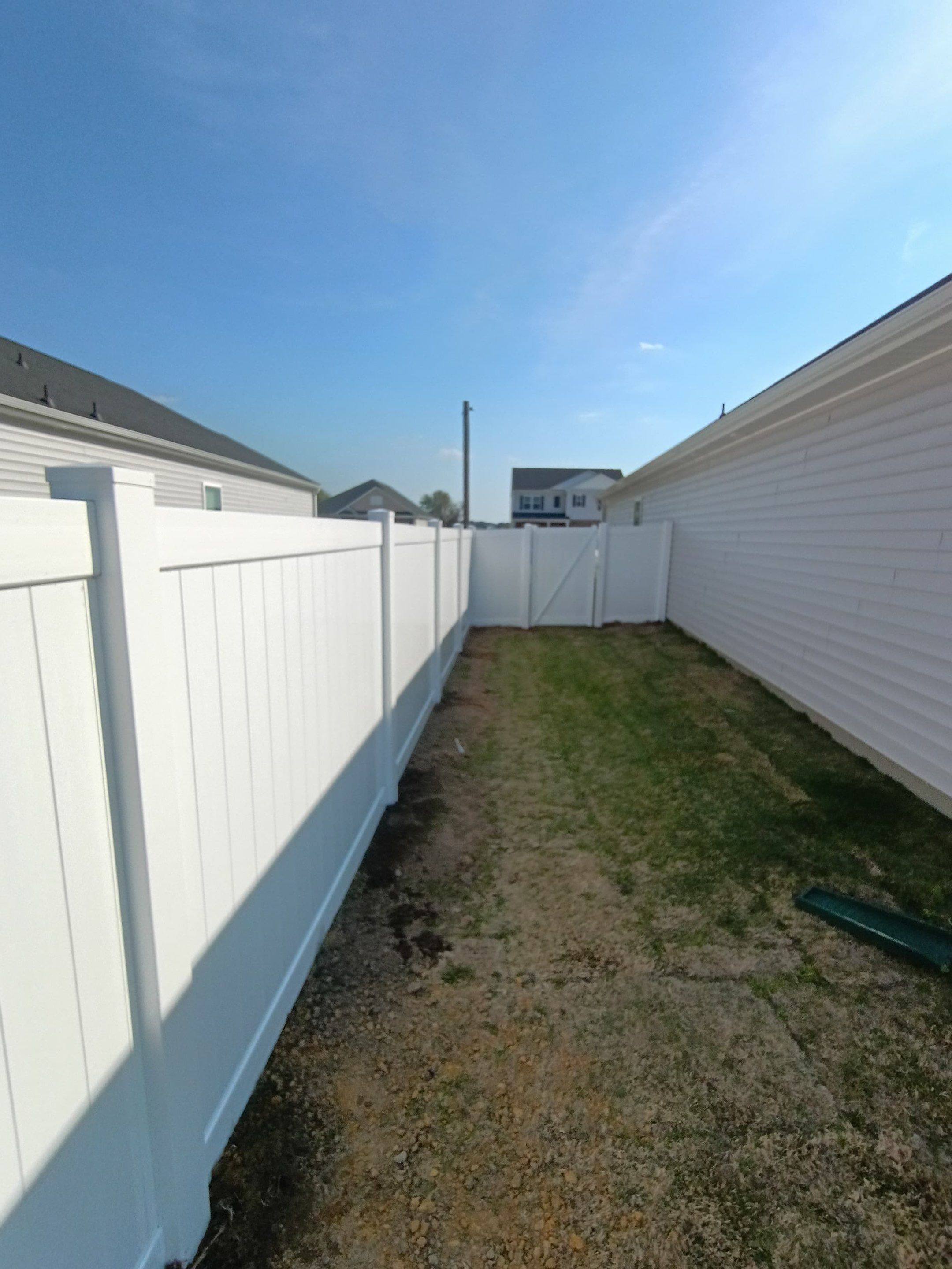 White Vinyl Privacy Fence Installation in Ayden, North Carolina by Superior Fence and Rail