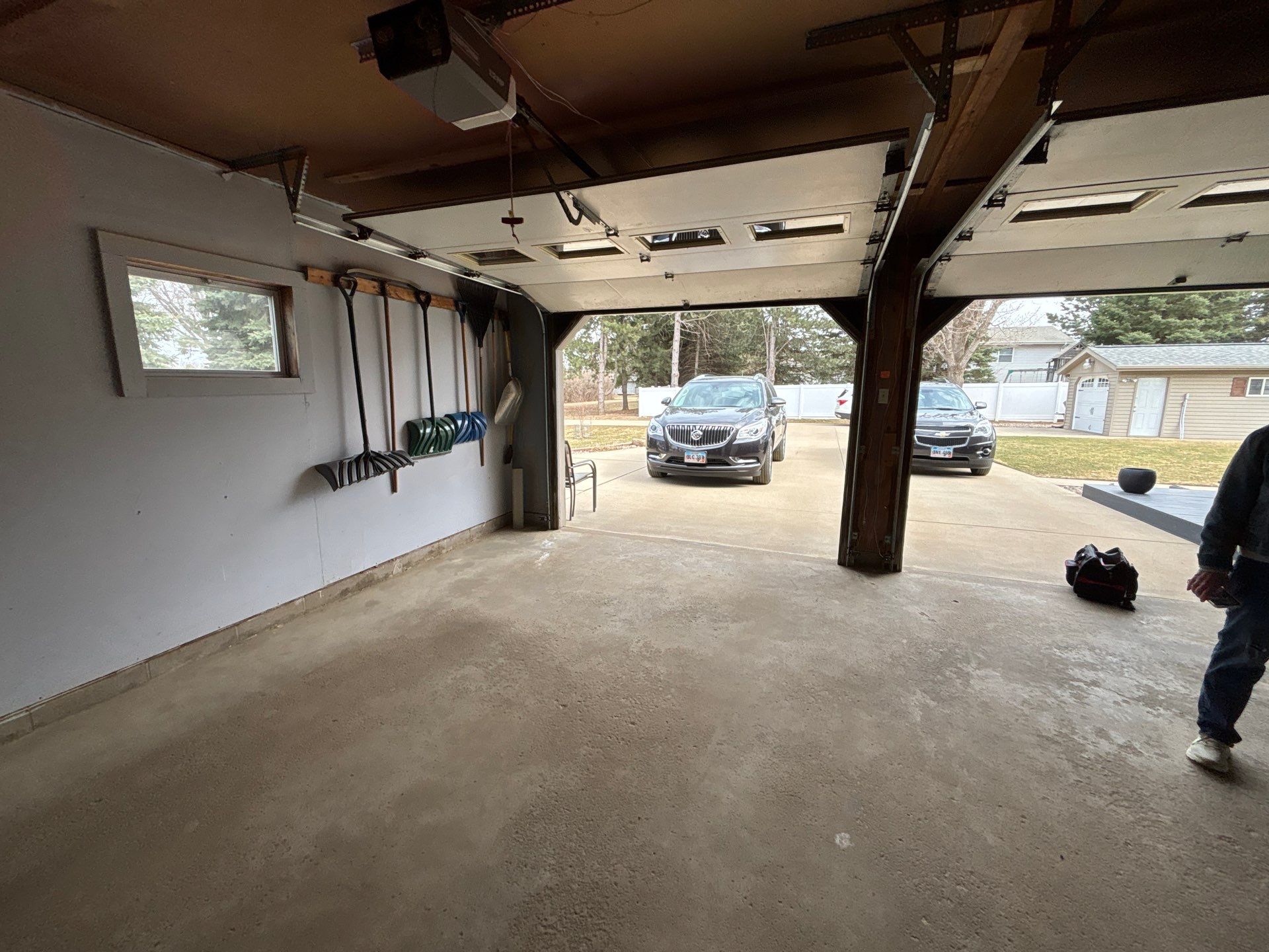 Full-Flake Epoxy Garage Floor Coating Installation in Sioux Falls by Select Painting, Coatings & Garage Cabinets