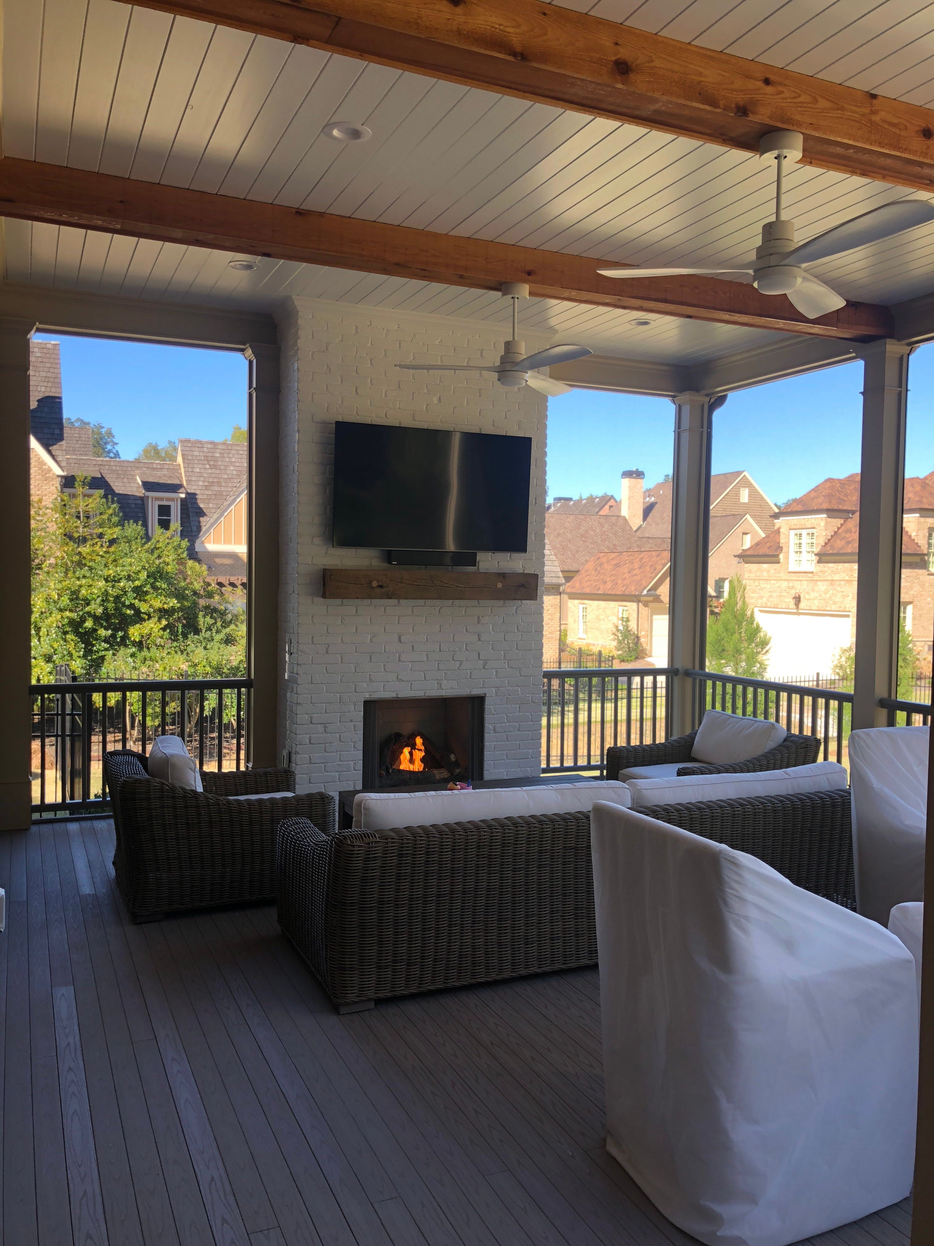 Custom Screened Porch Addition with White Brick Fireplace in Duluth by Swift Home Renovations