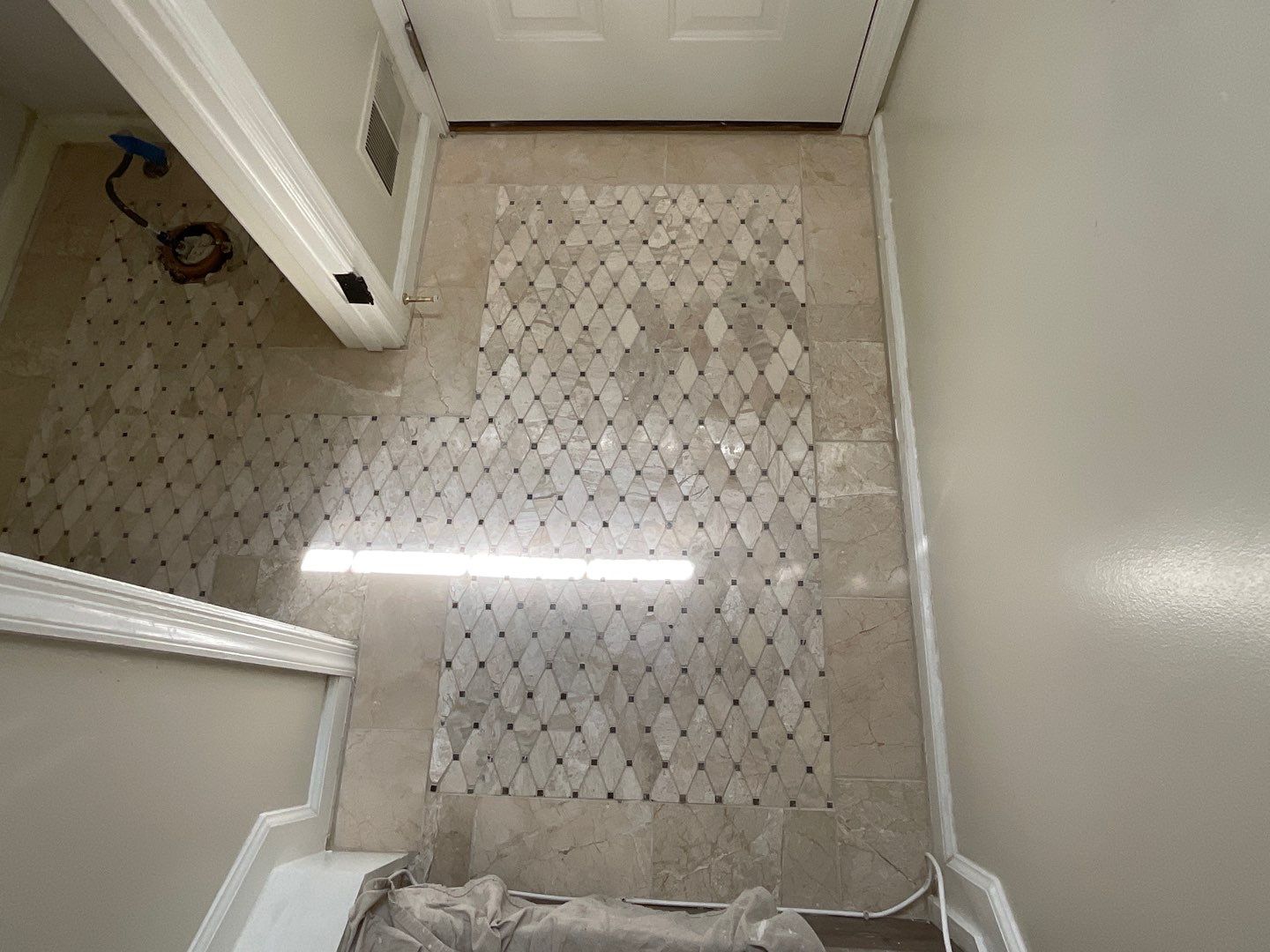 Bathroom Remodel using Two new bathroom design and new floors by Alpha Design Services