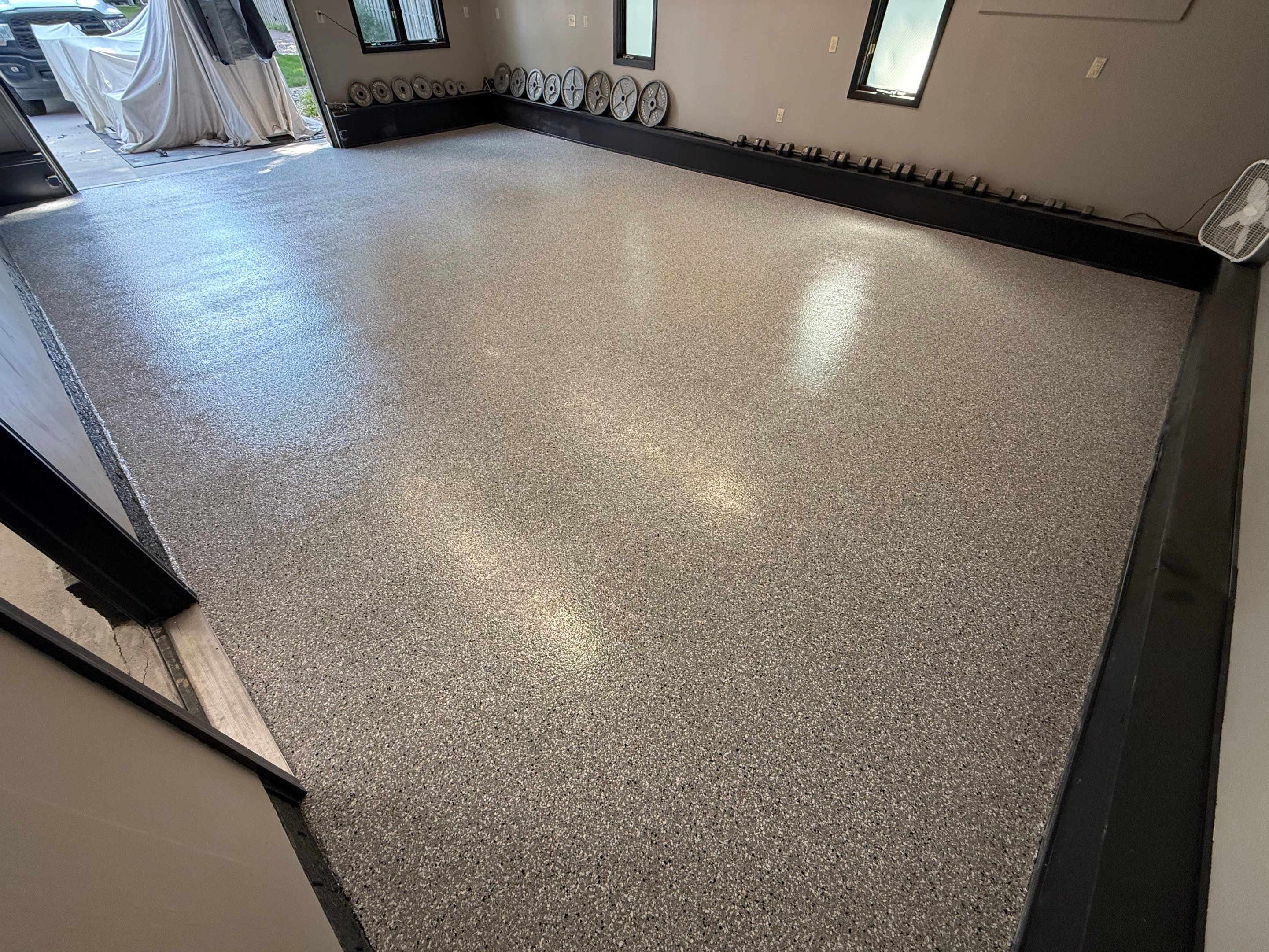 Garage Floor and Textured Pool Deck Coating in Sioux Falls by Select Painting, Coatings & Garage Cabinets