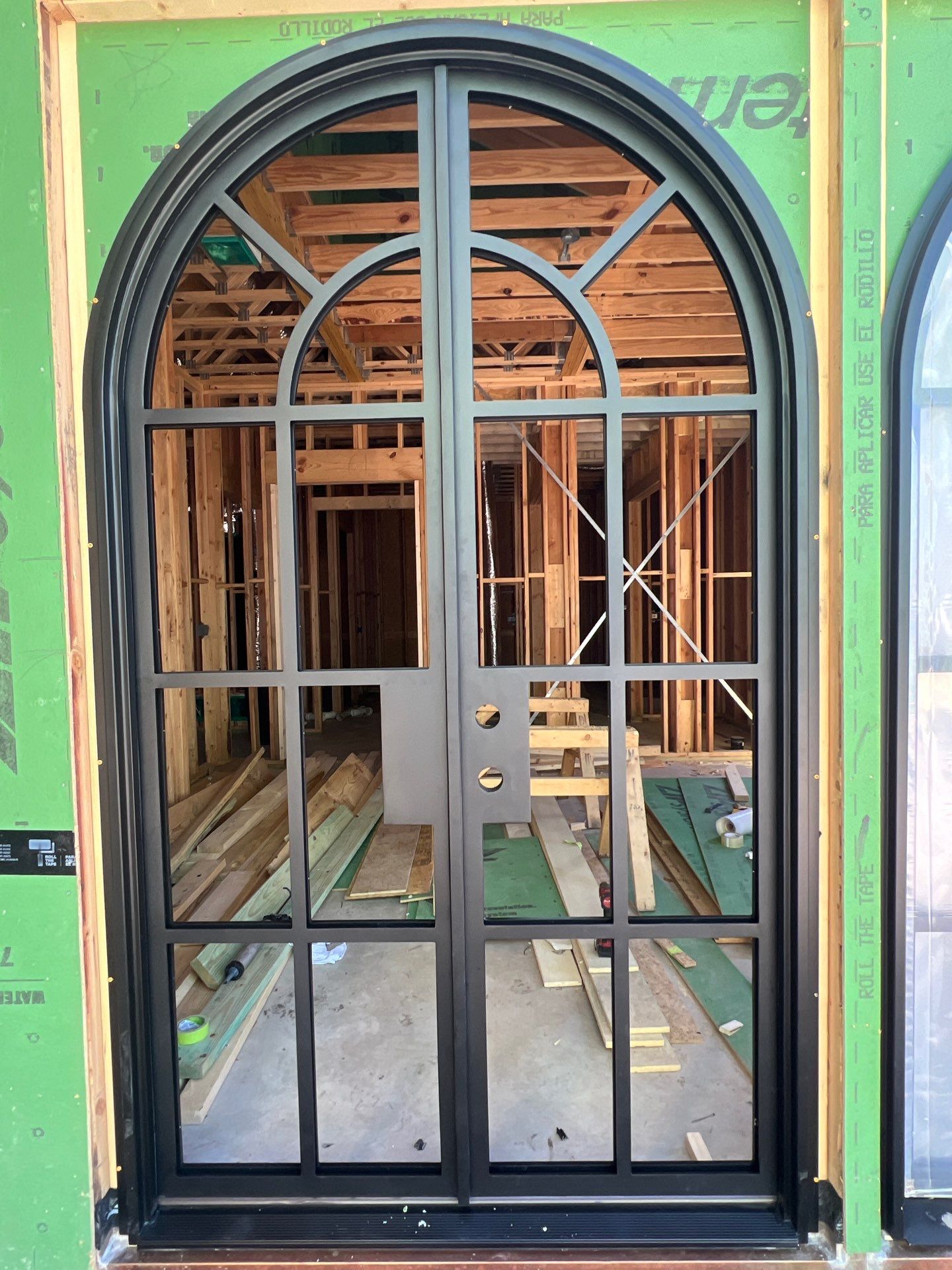Arched Black Metal French Door Installation and Finishing in Fort Worth by Solara Custom Living