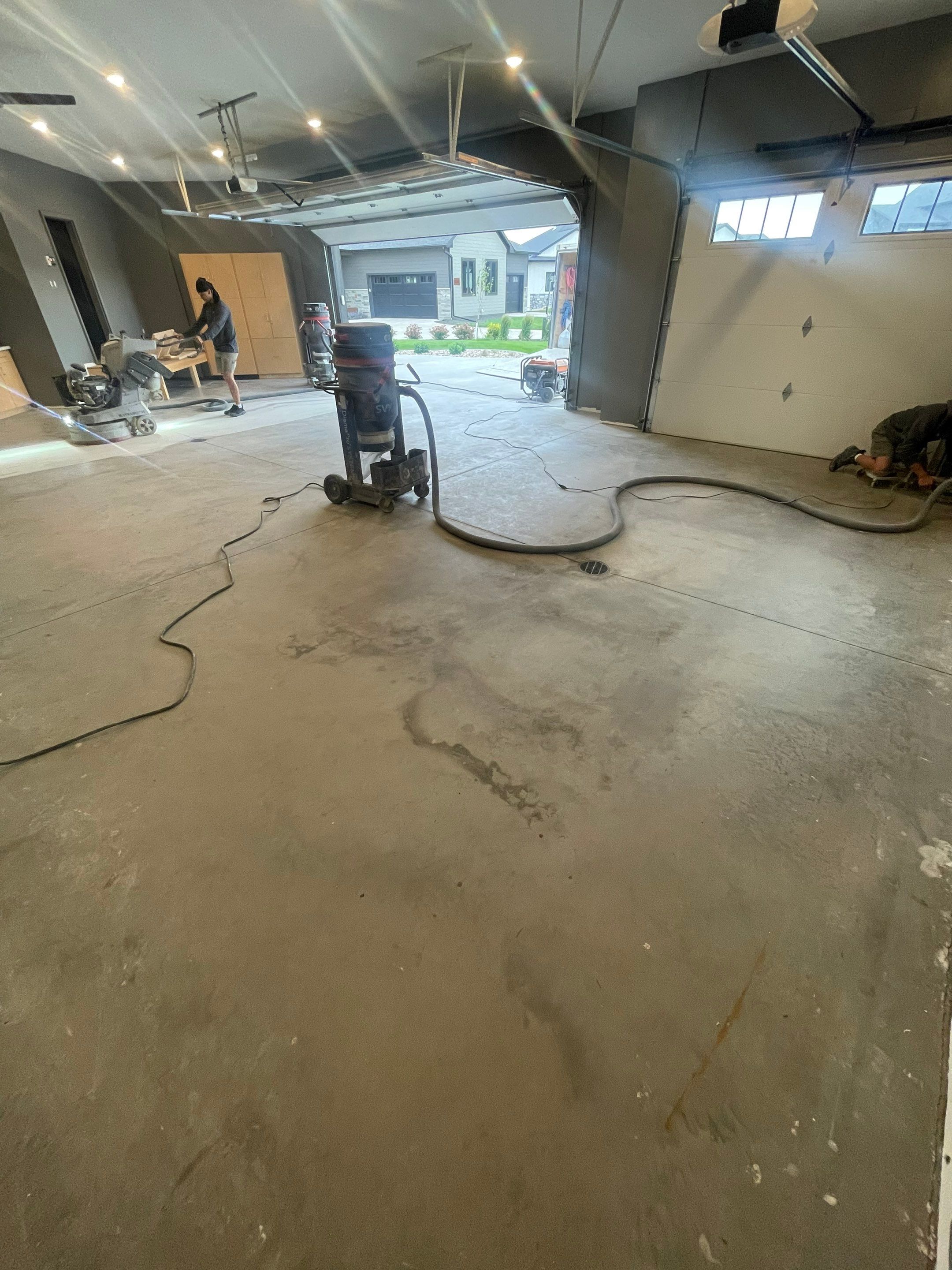 Custom Speckled Concrete Coating for Dell Rapids Garage by Select Painting, Coatings & Garage Cabinets