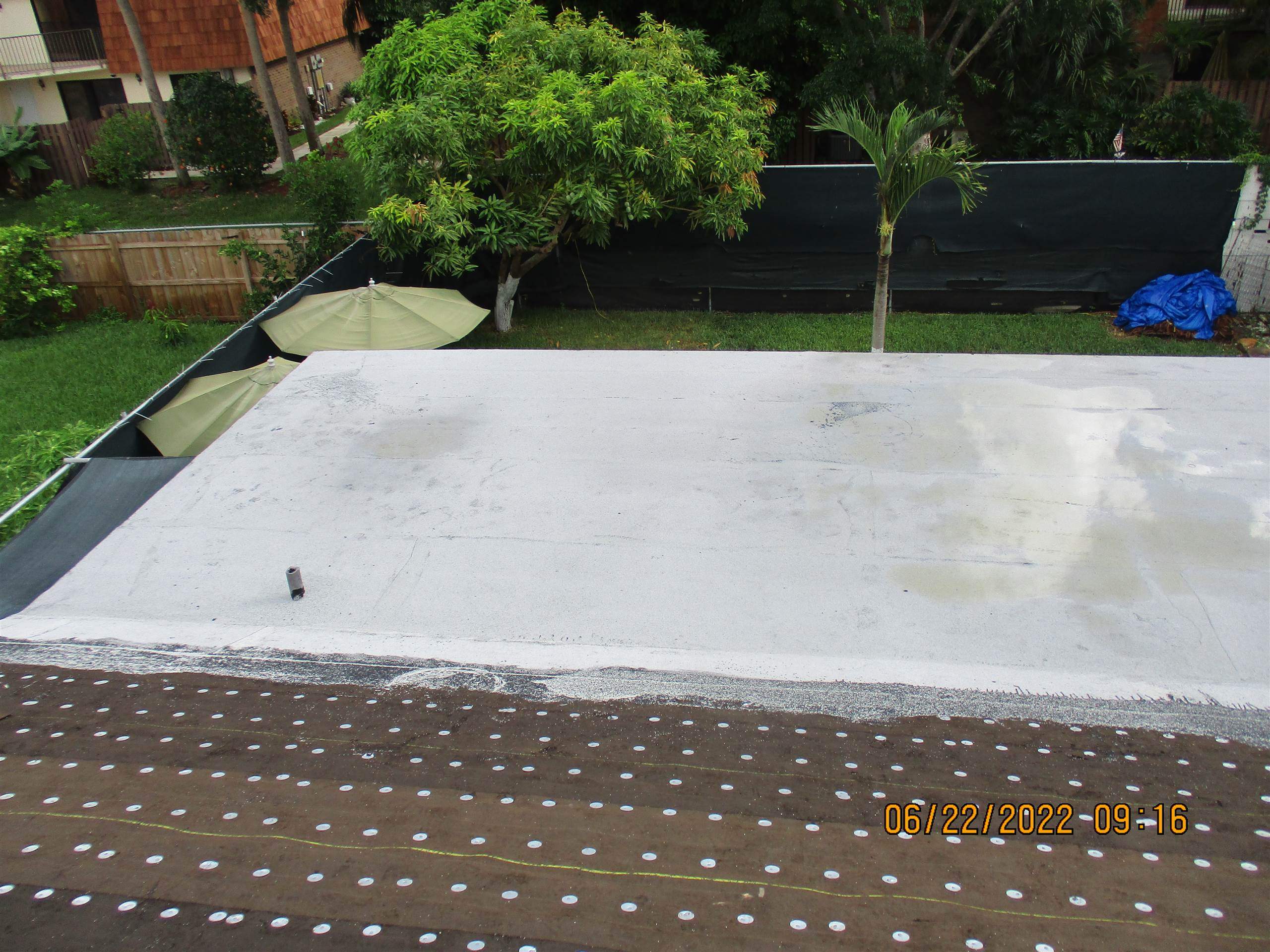 Residential Roofing Installation using 1.5" Nail Strip 24ga Solar White Kynar Coated Standing Seam Metal Panels by Morton Roofing, Inc.